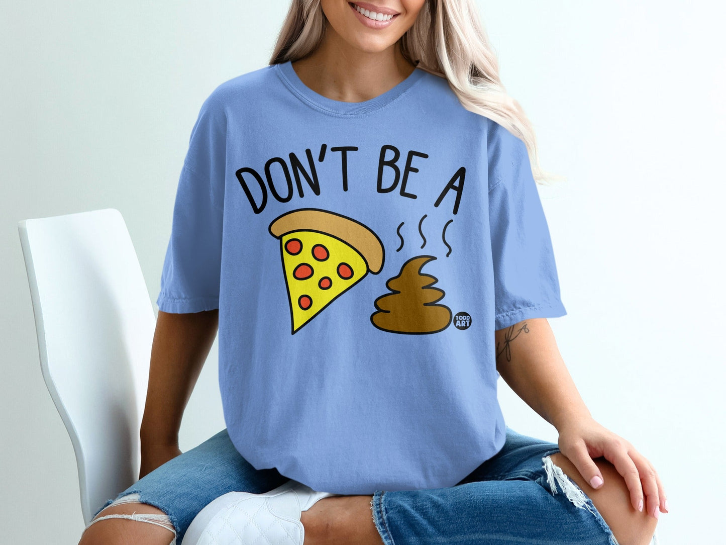 Blue t-shirt with "DON'T BE A" and pizza slice next to brown poop emoji.