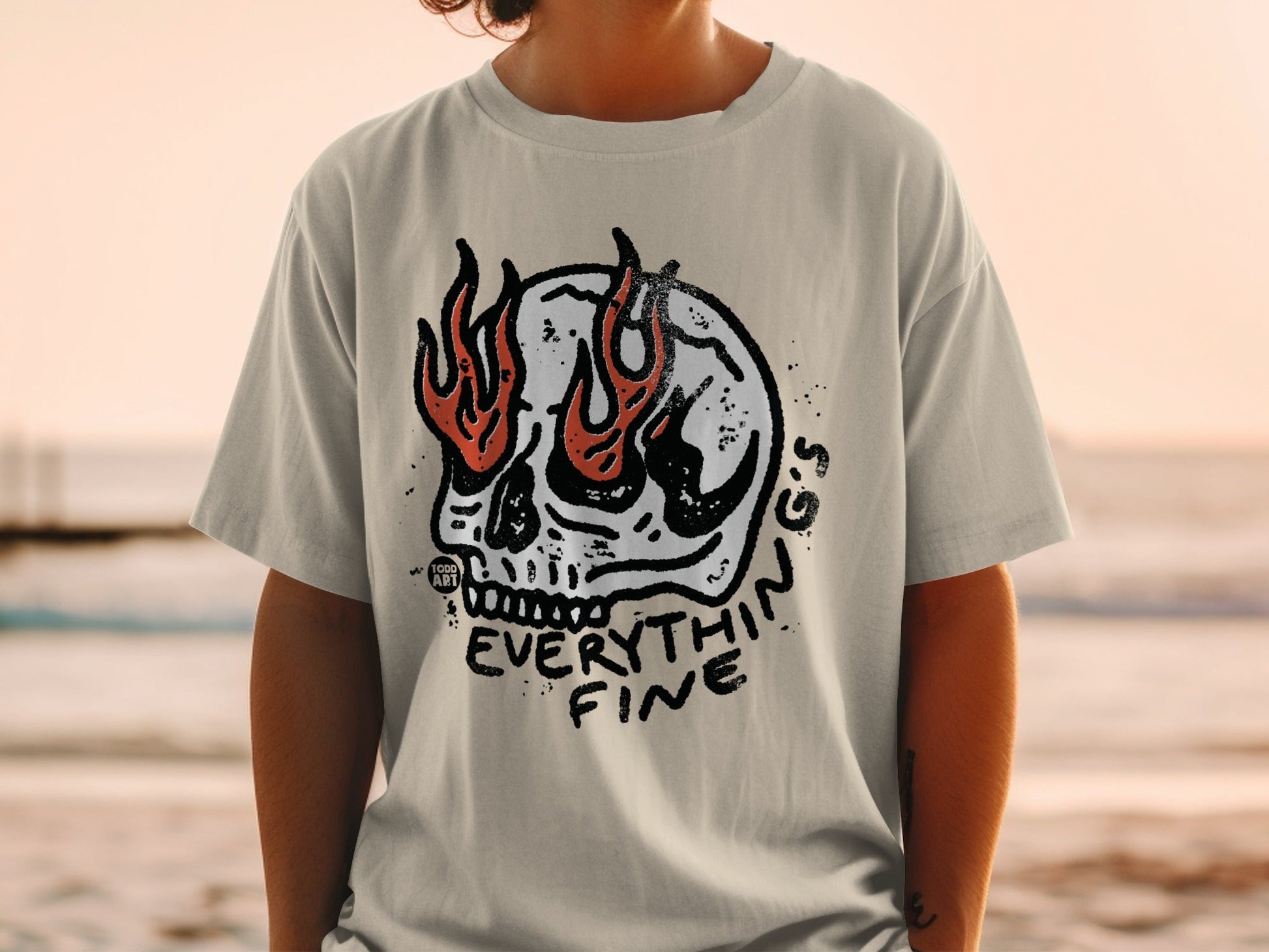 T-shirt featuring a skull with flames and "Everything Fine" text.