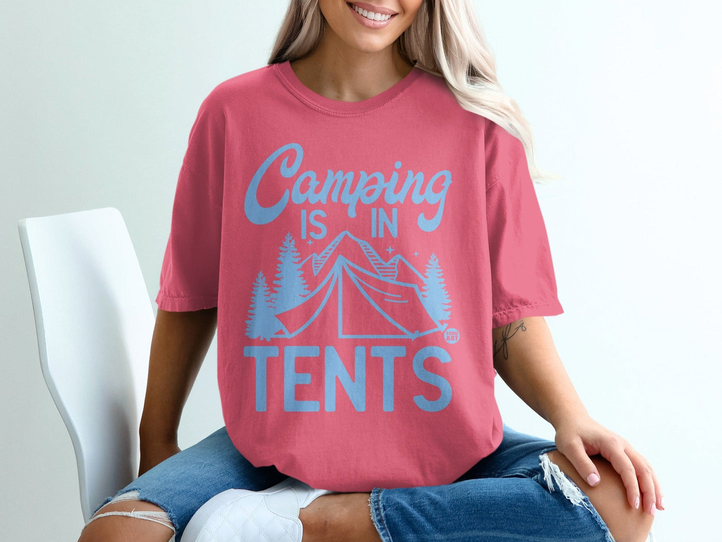Coral t-shirt with "Camping is in Tents" text and tent graphic.