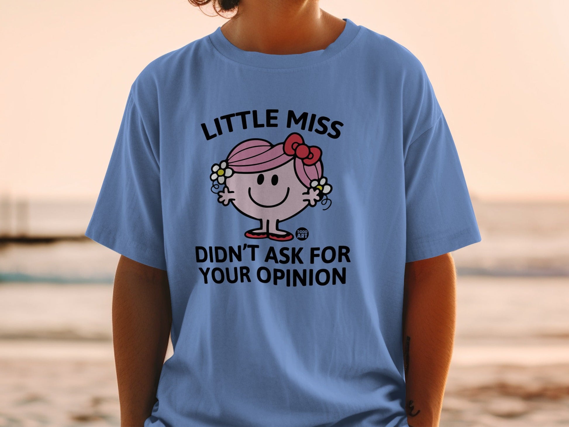 Blue t-shirt with "Little Miss Didn't Ask For Your Opinion" graphic.