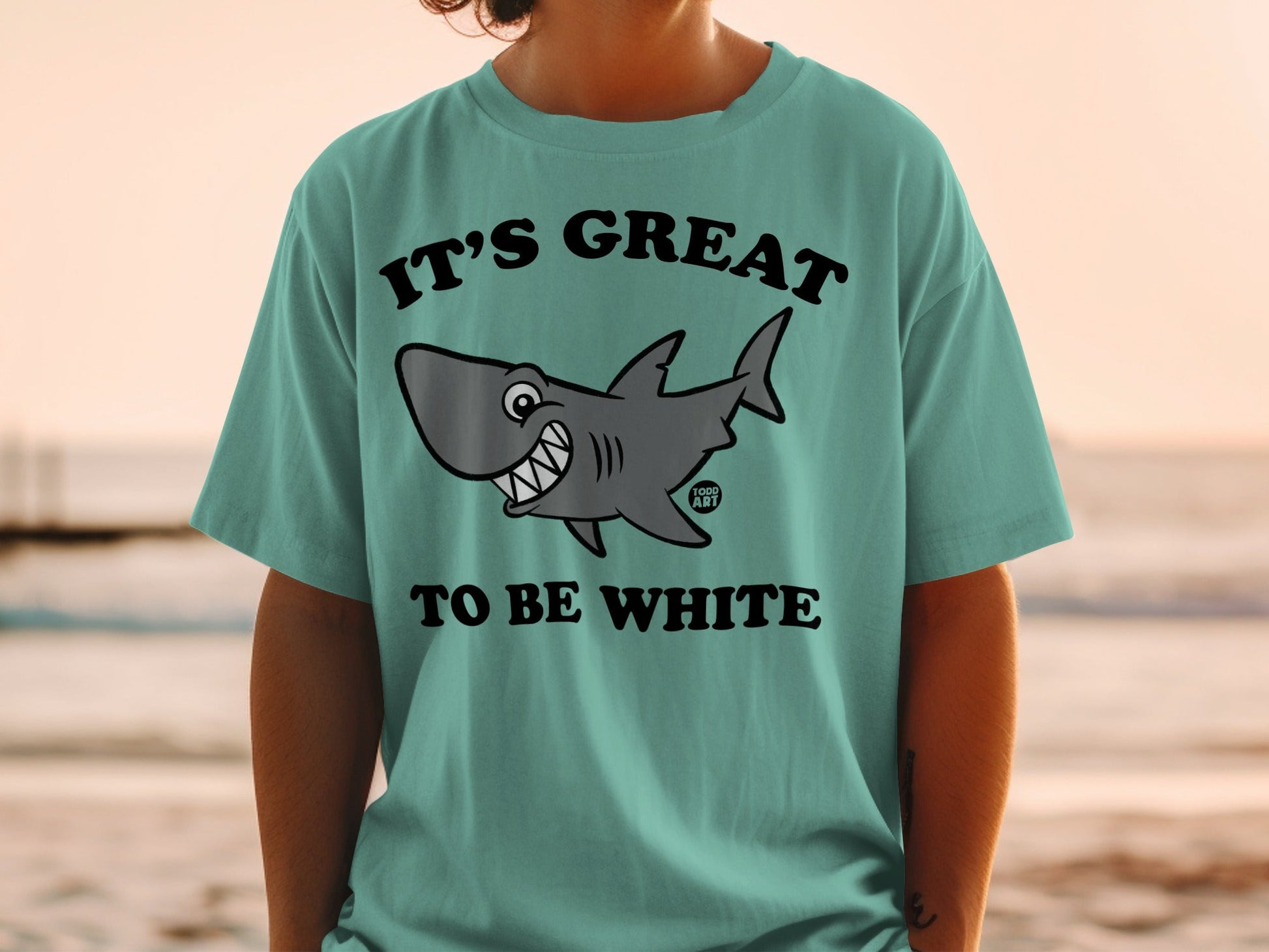 T-shirt with cartoon shark and text "IT'S GREAT TO BE WHITE".