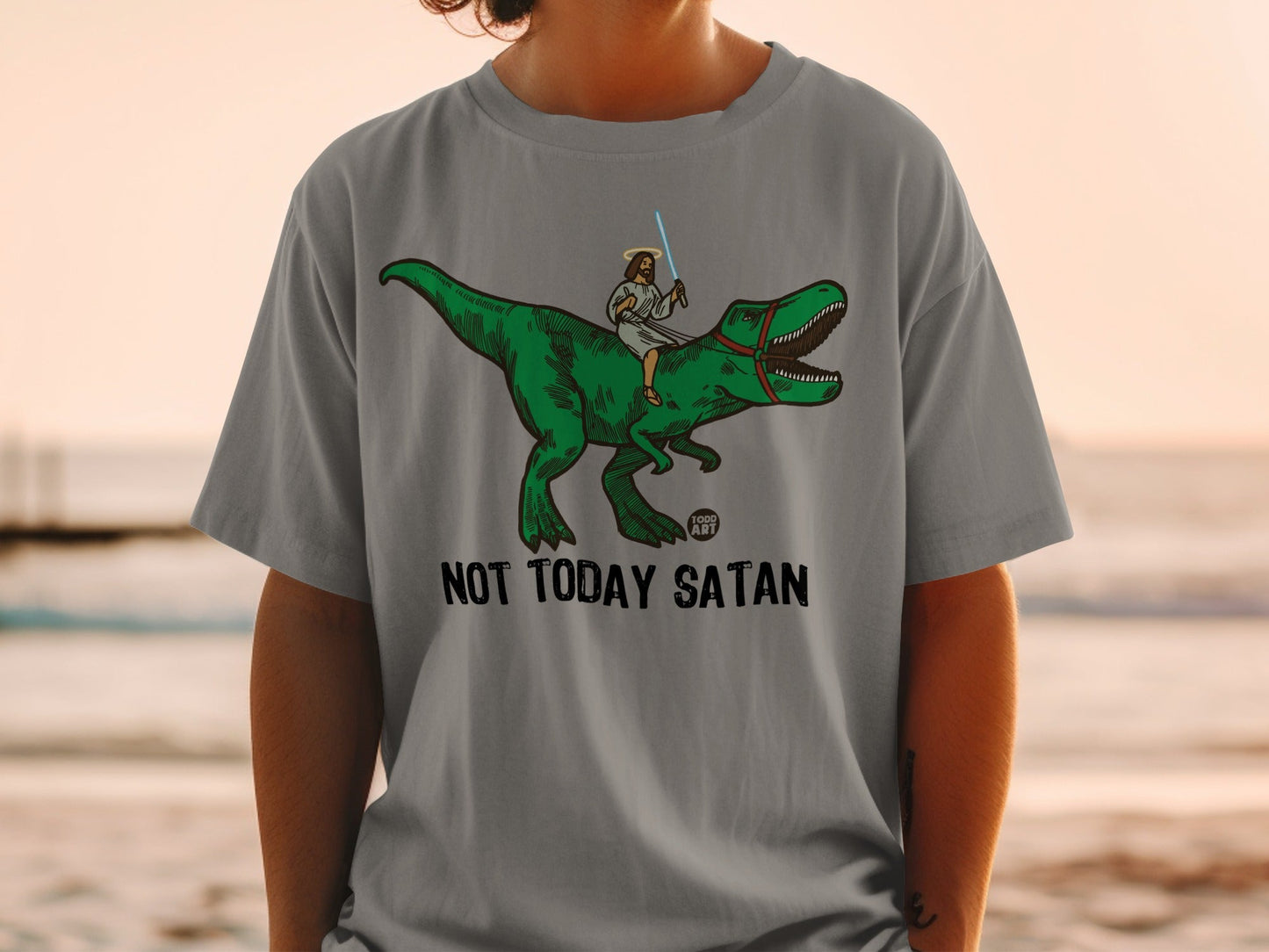 Jesus riding a T-Rex with a lightsaber, "NOT TODAY SATAN" text.