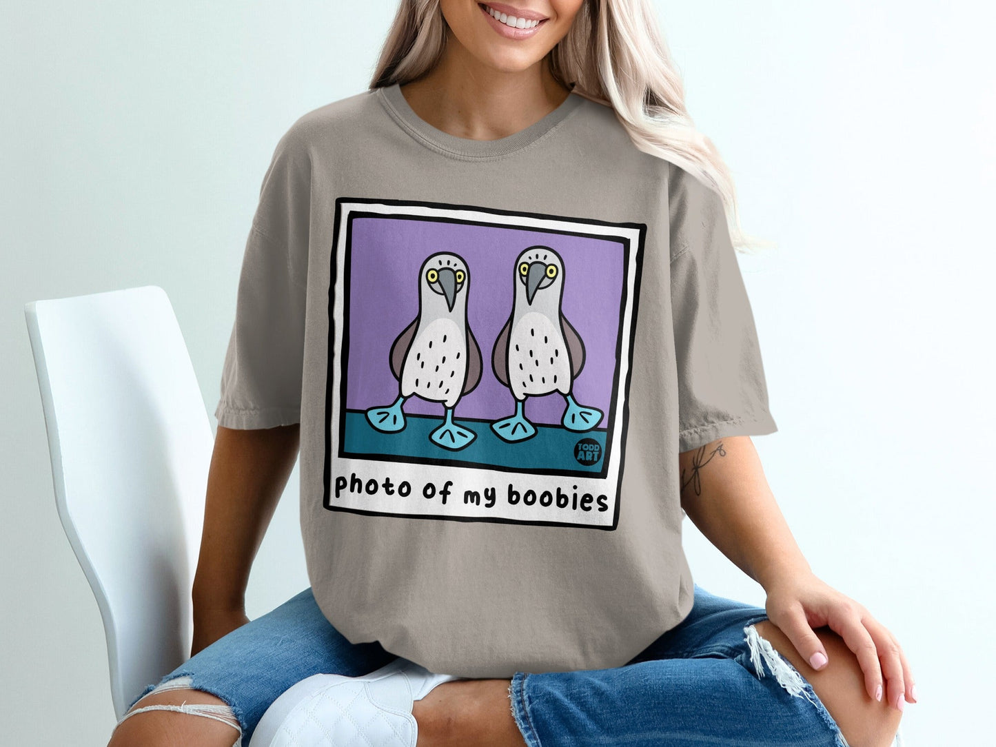 Gray t-shirt with cartoon boobies and text "photo of my boobies".