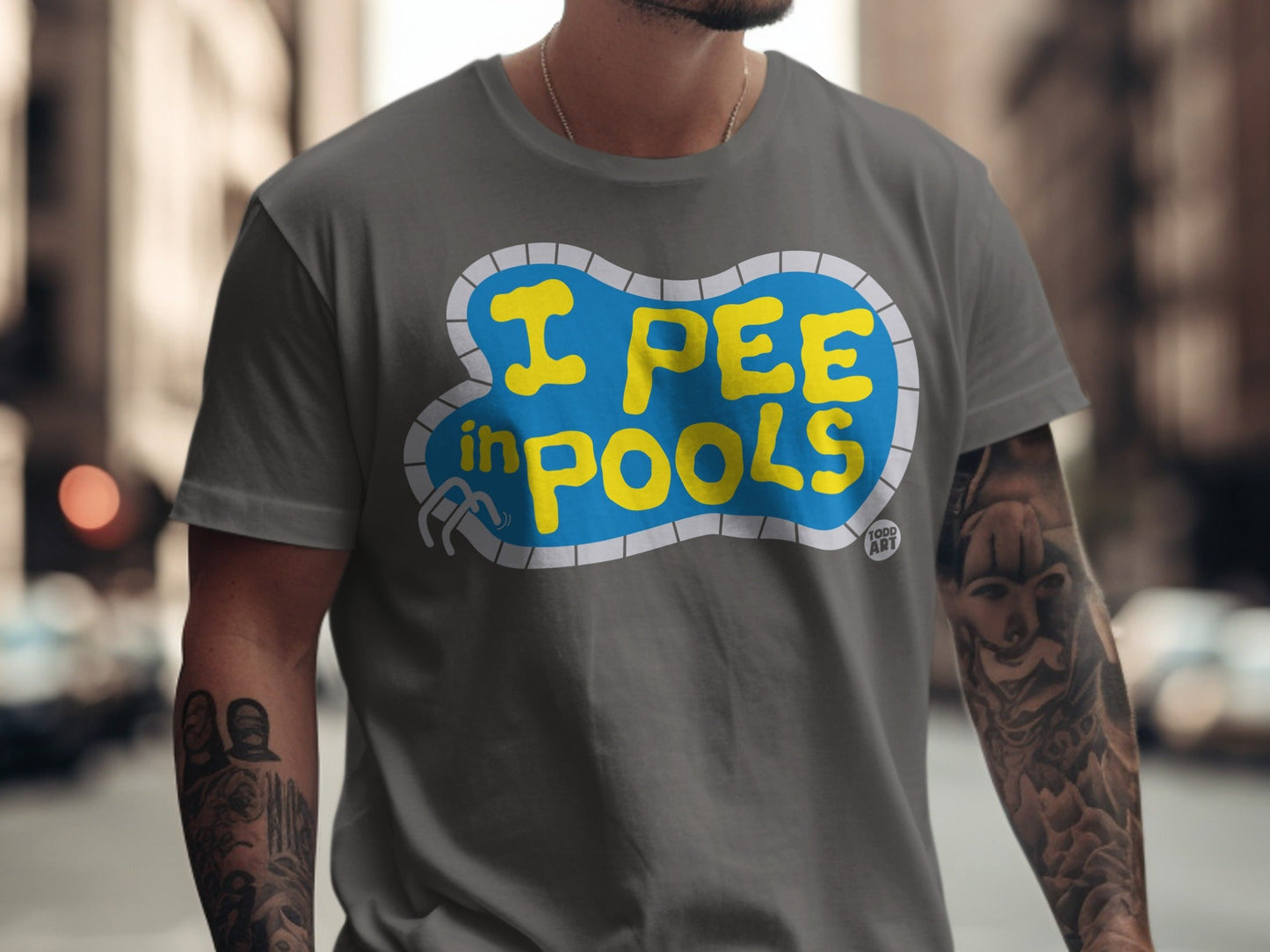 Gray t-shirt with "I PEE IN POOLS" text inside a blue pool graphic.