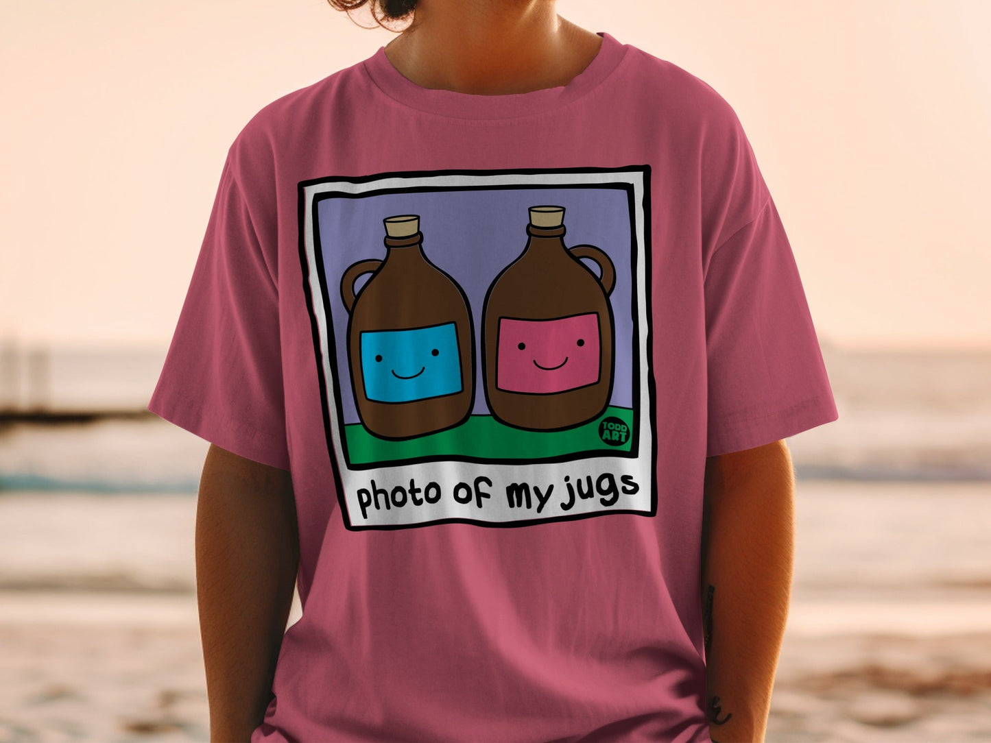 Two jugs with smiling faces on a t-shirt with "photo of my jugs" text.