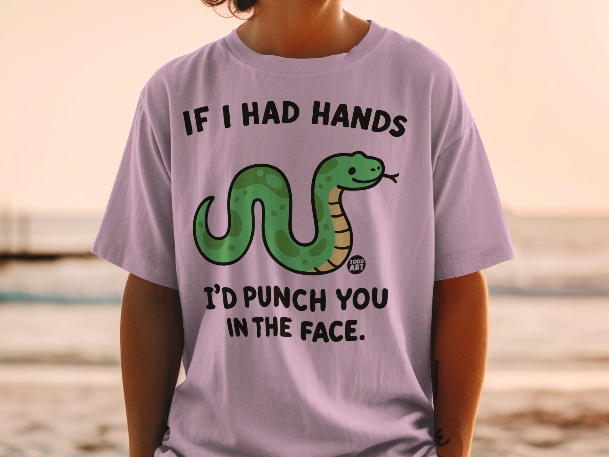 Purple t-shirt with a cartoon snake and text reading "If I had hands I'd punch you in the face."