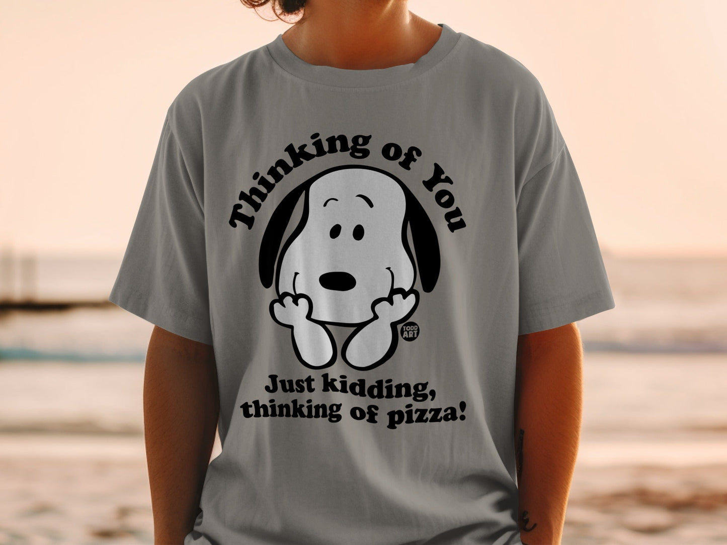 Gray t-shirt with Snoopy graphic and "Thinking of you. Just kidding, thinking of pizza!" text.