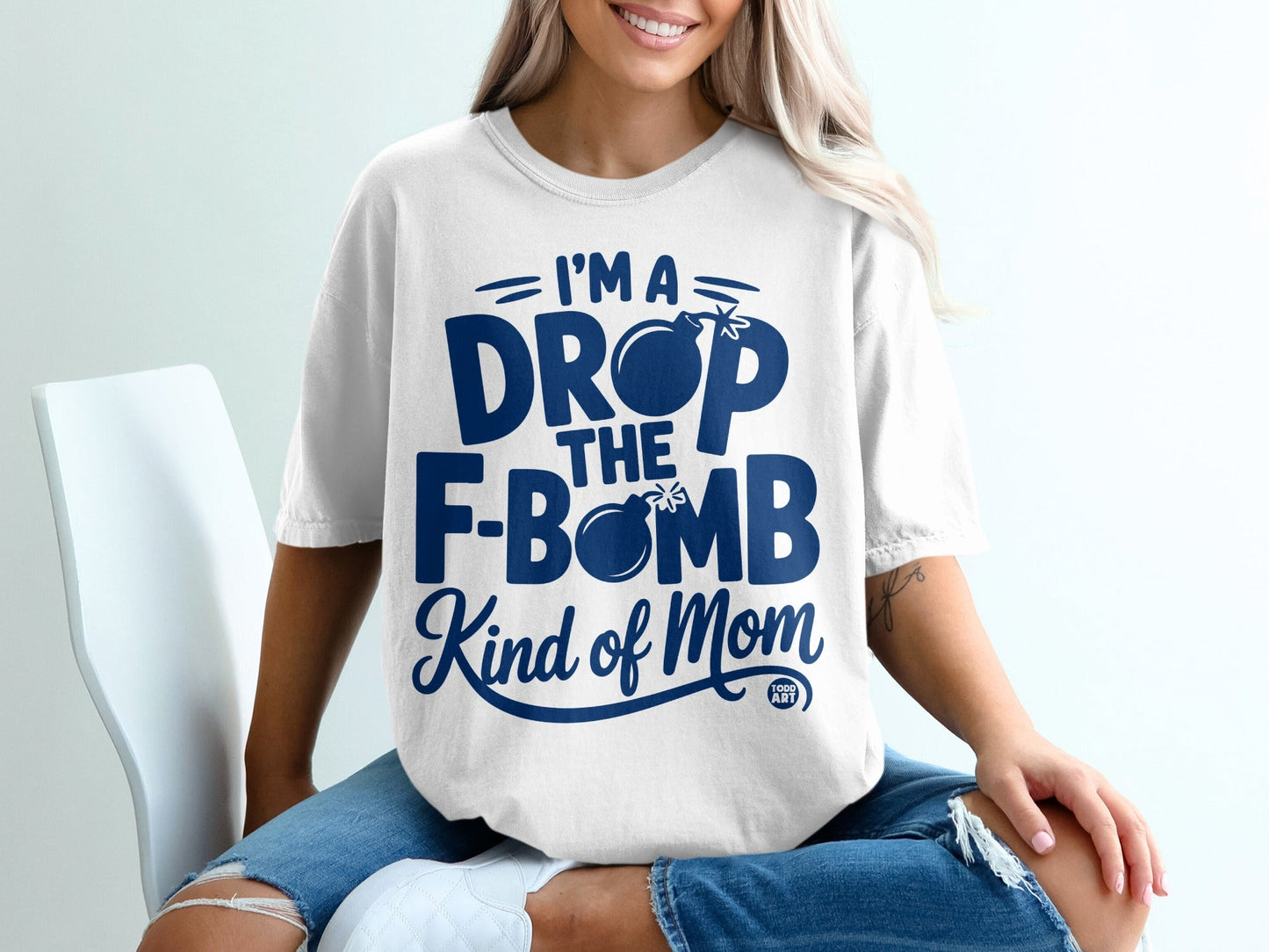 White t-shirt with "I'm a DROP the F-BOMB Kind of Mom" graphic.
