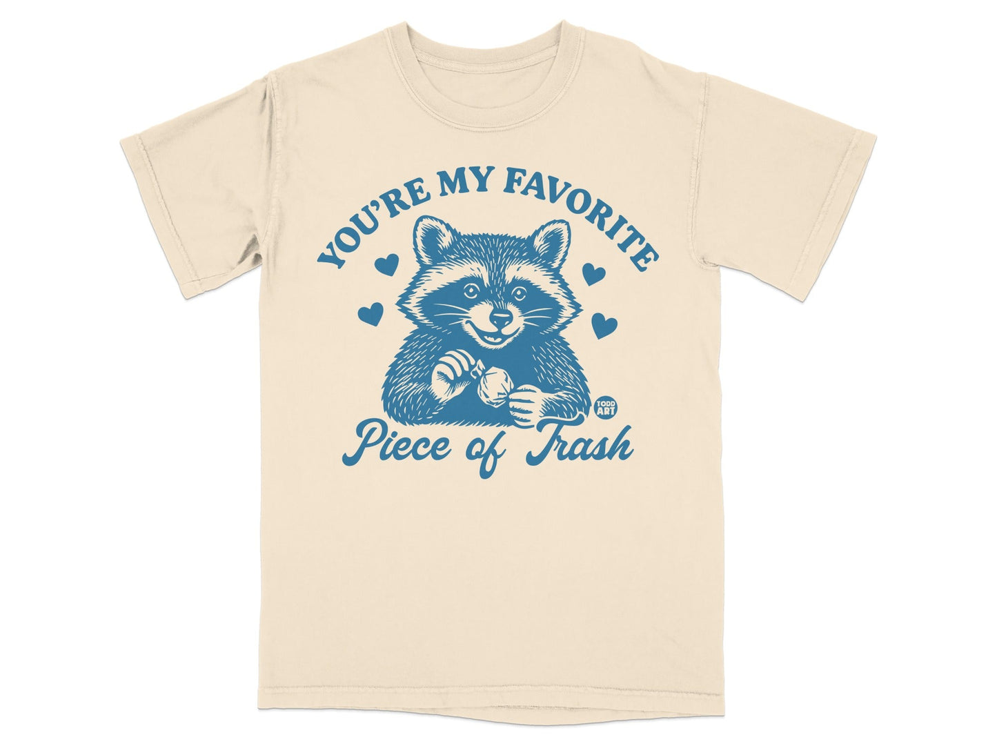 T-shirt with raccoon holding a heart and "You're my favorite piece of trash" text.