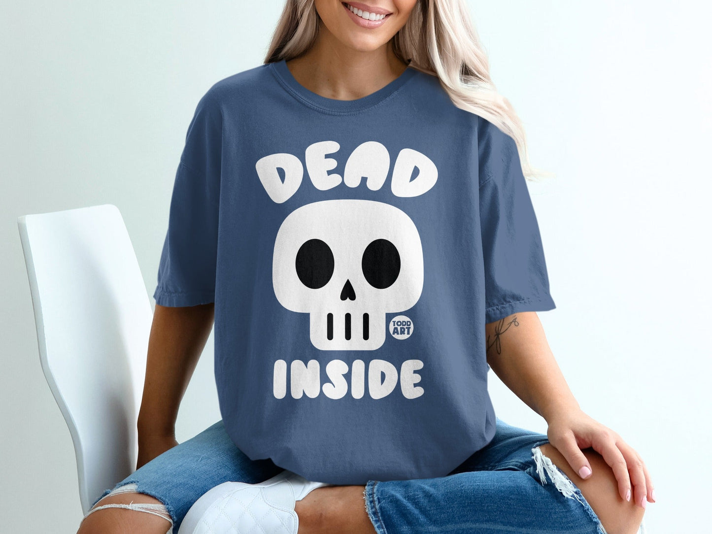Blue t-shirt with "DEAD INSIDE" and a skull graphic.