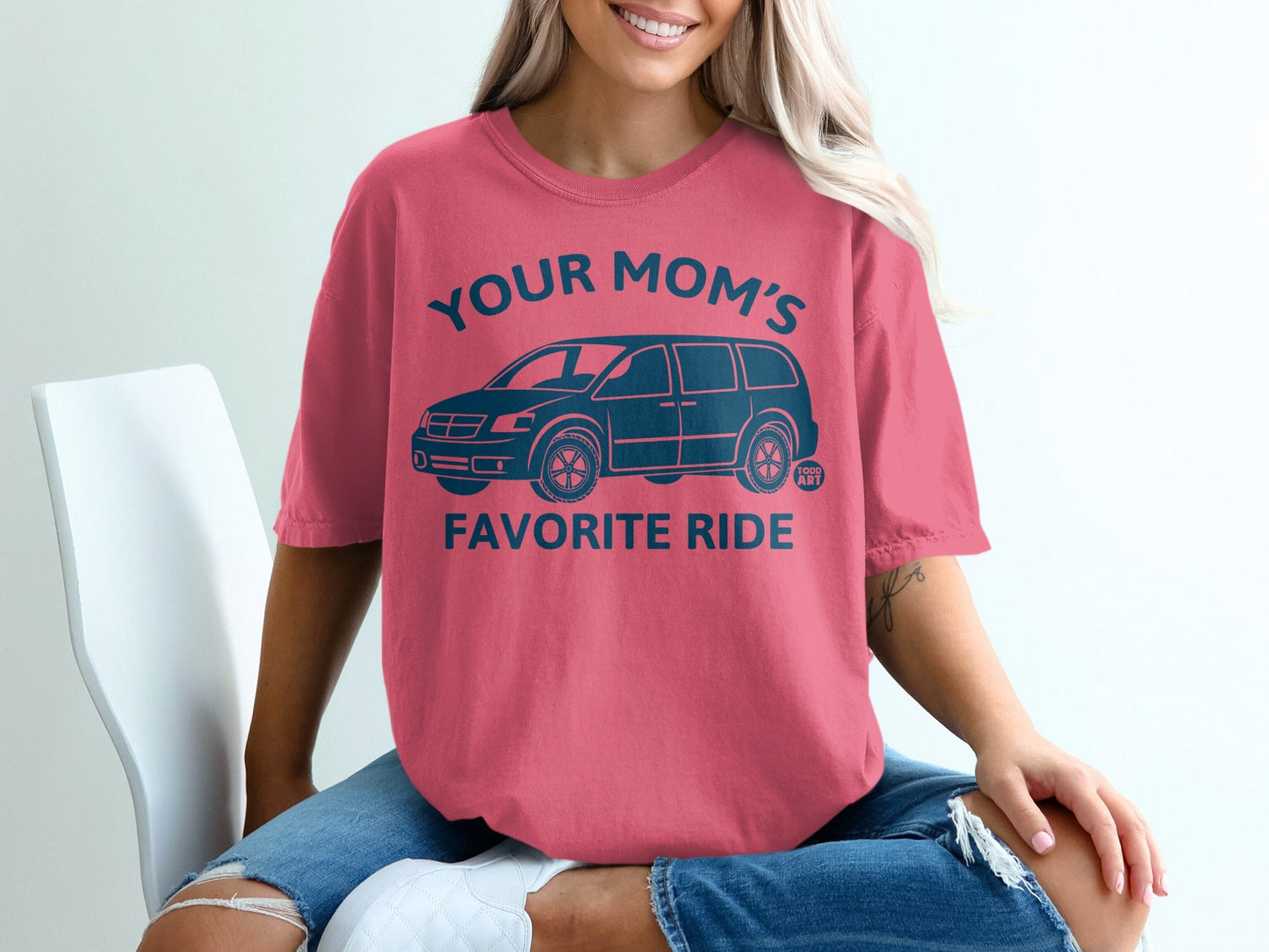 Coral graphic t-shirt with dark blue van and text "Your Mom's Favorite Ride".