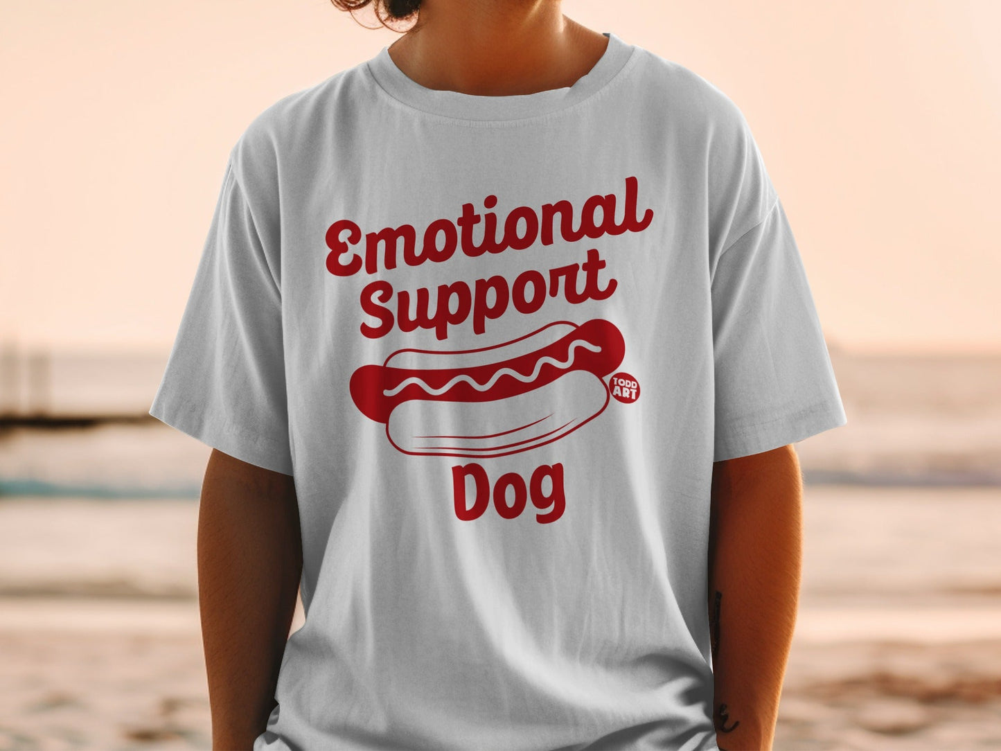White t-shirt with "Emotional Support Dog" and a hot dog graphic.