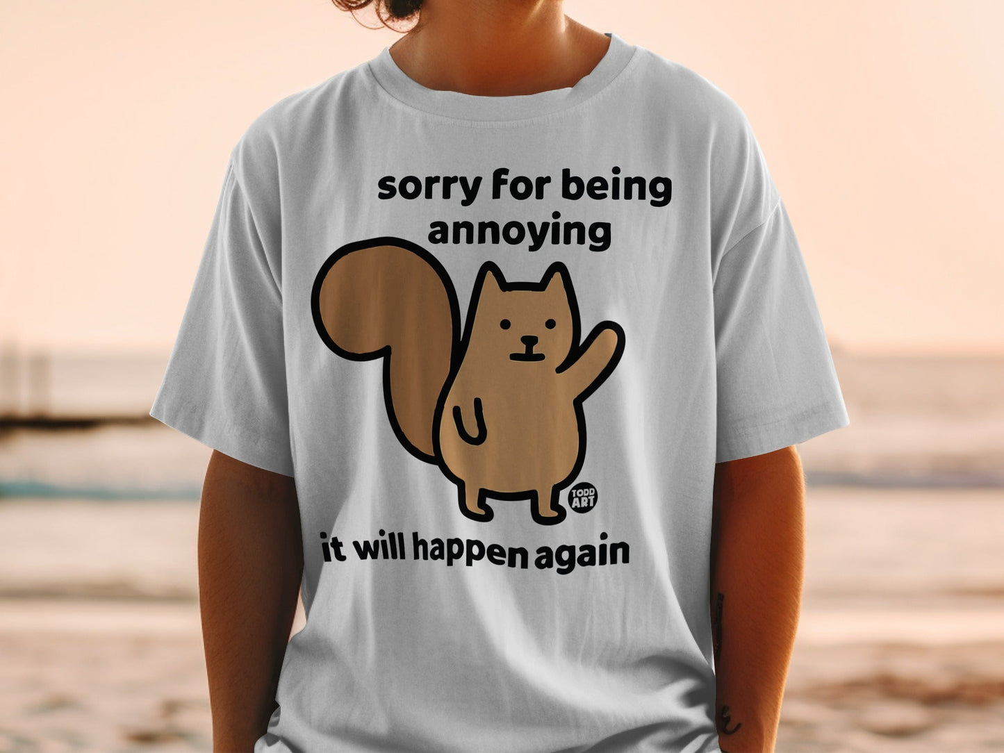 T-shirt with a cartoon squirrel and text "sorry for being annoying it will happen again".
