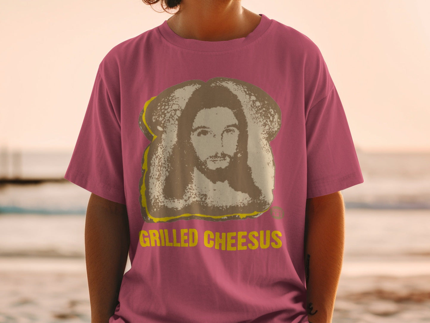 Maroon t-shirt with "Grilled Cheesus" text and image of Jesus on toast.
