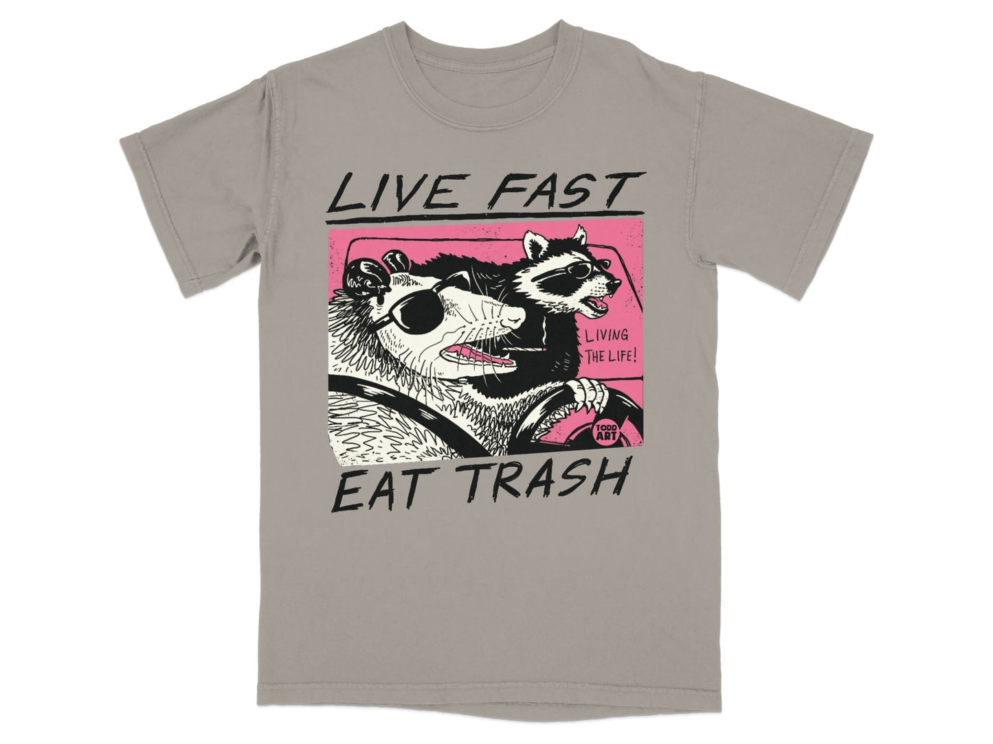 T-shirt with possum and raccoon in a car, text reads "LIVE FAST EAT TRASH".