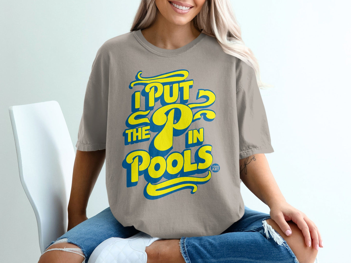 T-shirt with yellow text "I PUT THE P IN POOLS".