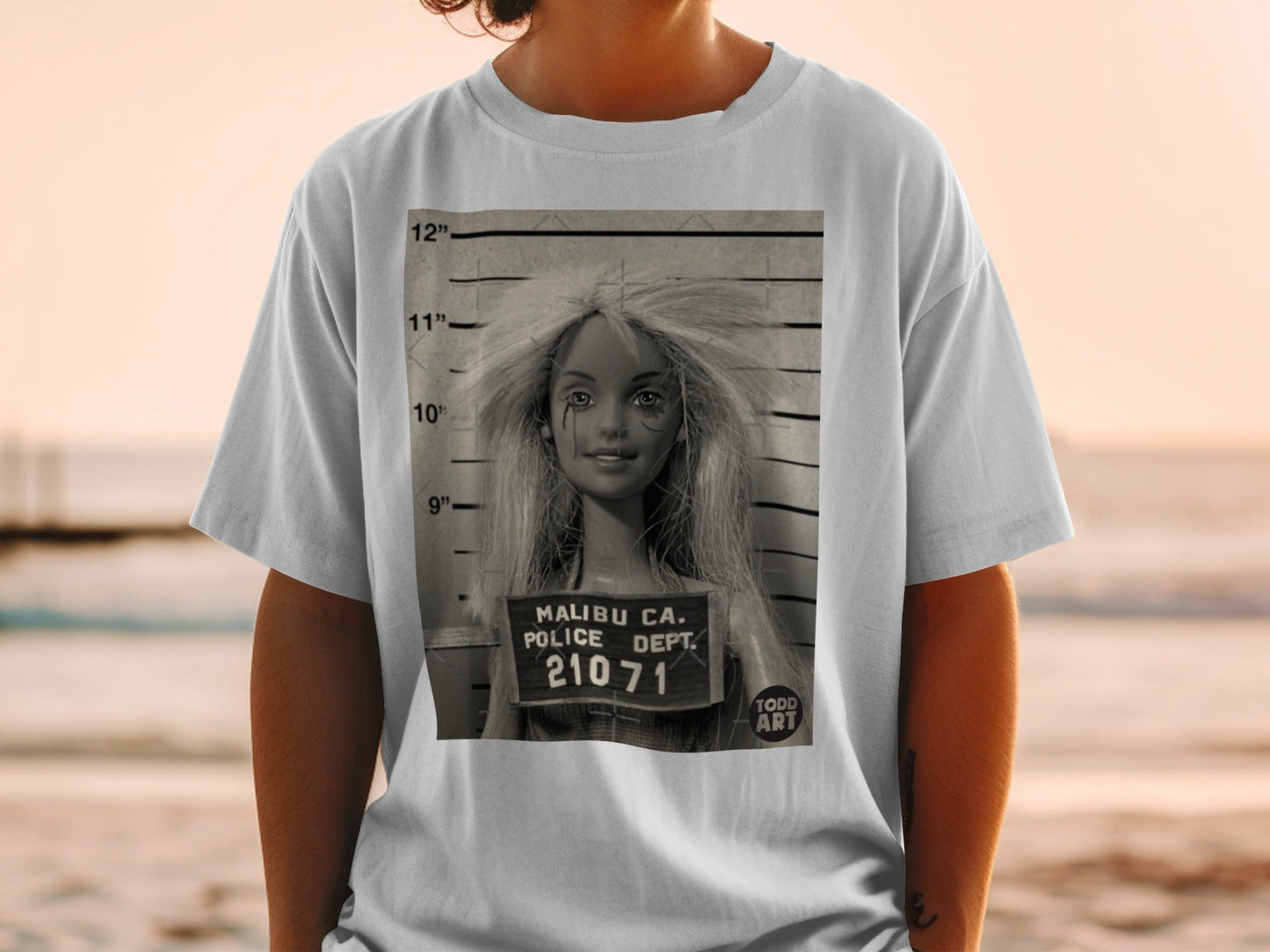 Barbie mugshot on a white t-shirt with Malibu CA Police Dept. 21071.