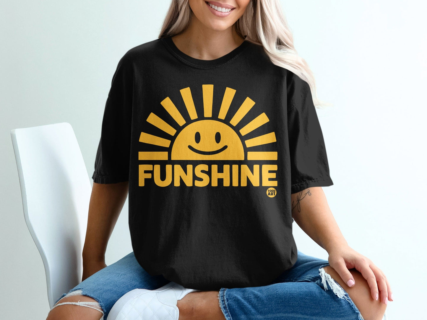 Black t-shirt with a smiling sun graphic and "FUNSHINE" text.