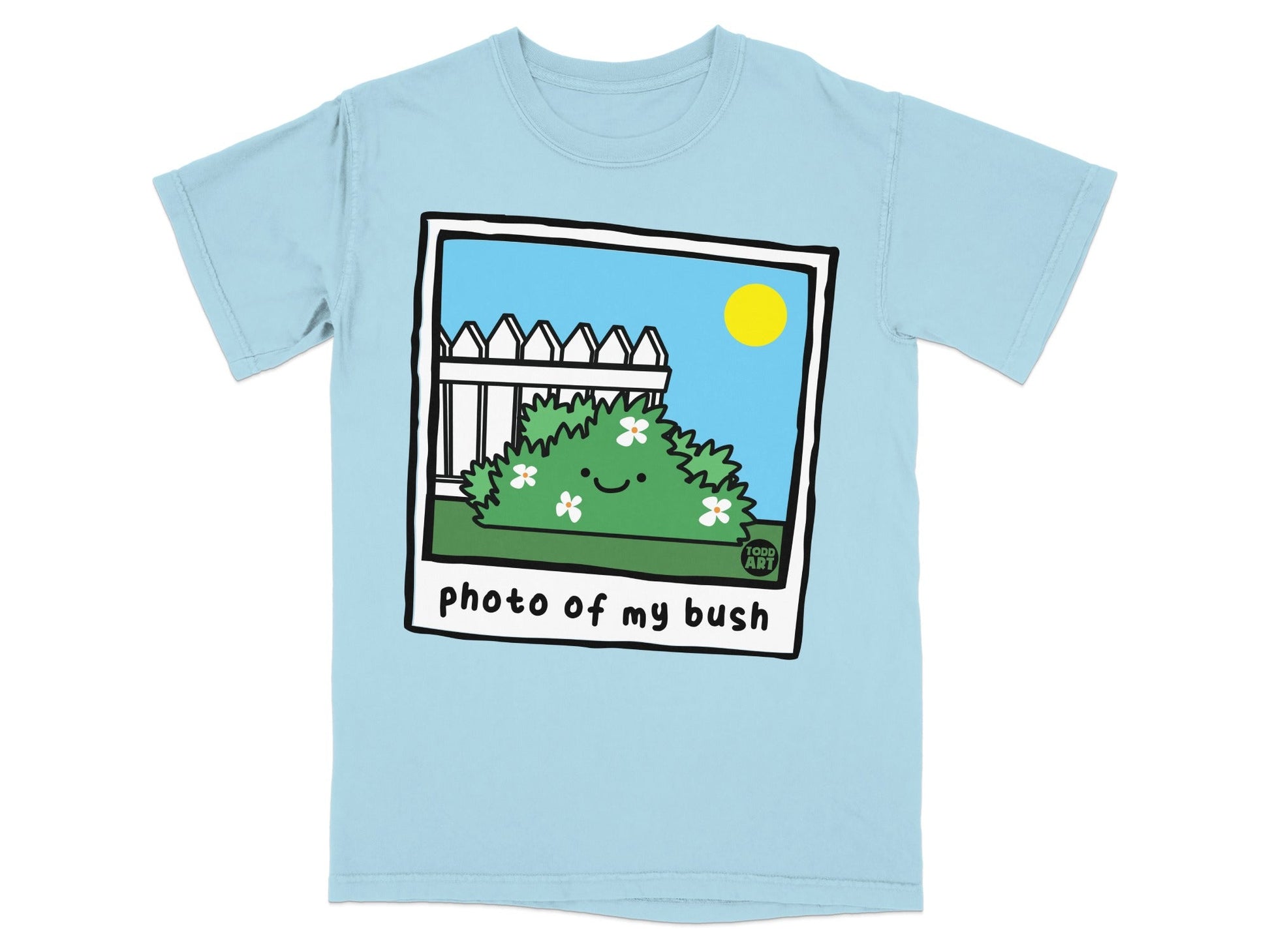 Light blue t-shirt with cartoon of smiling bush, fence, and sun.