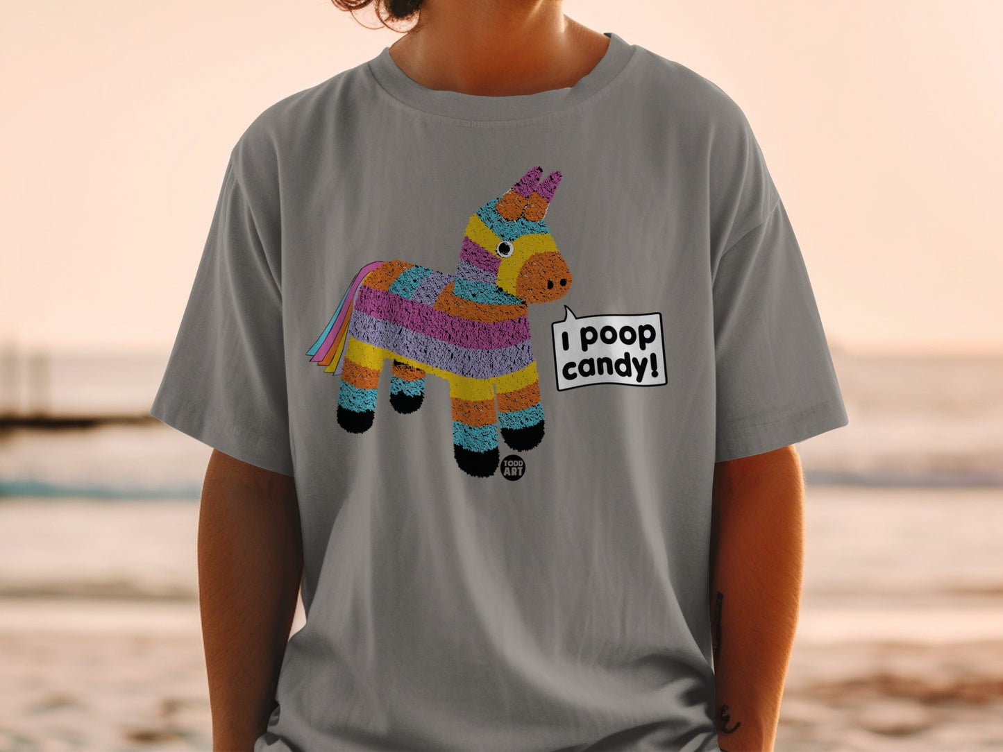 T-shirt with colorful pi√±ata character saying "I poop candy!".