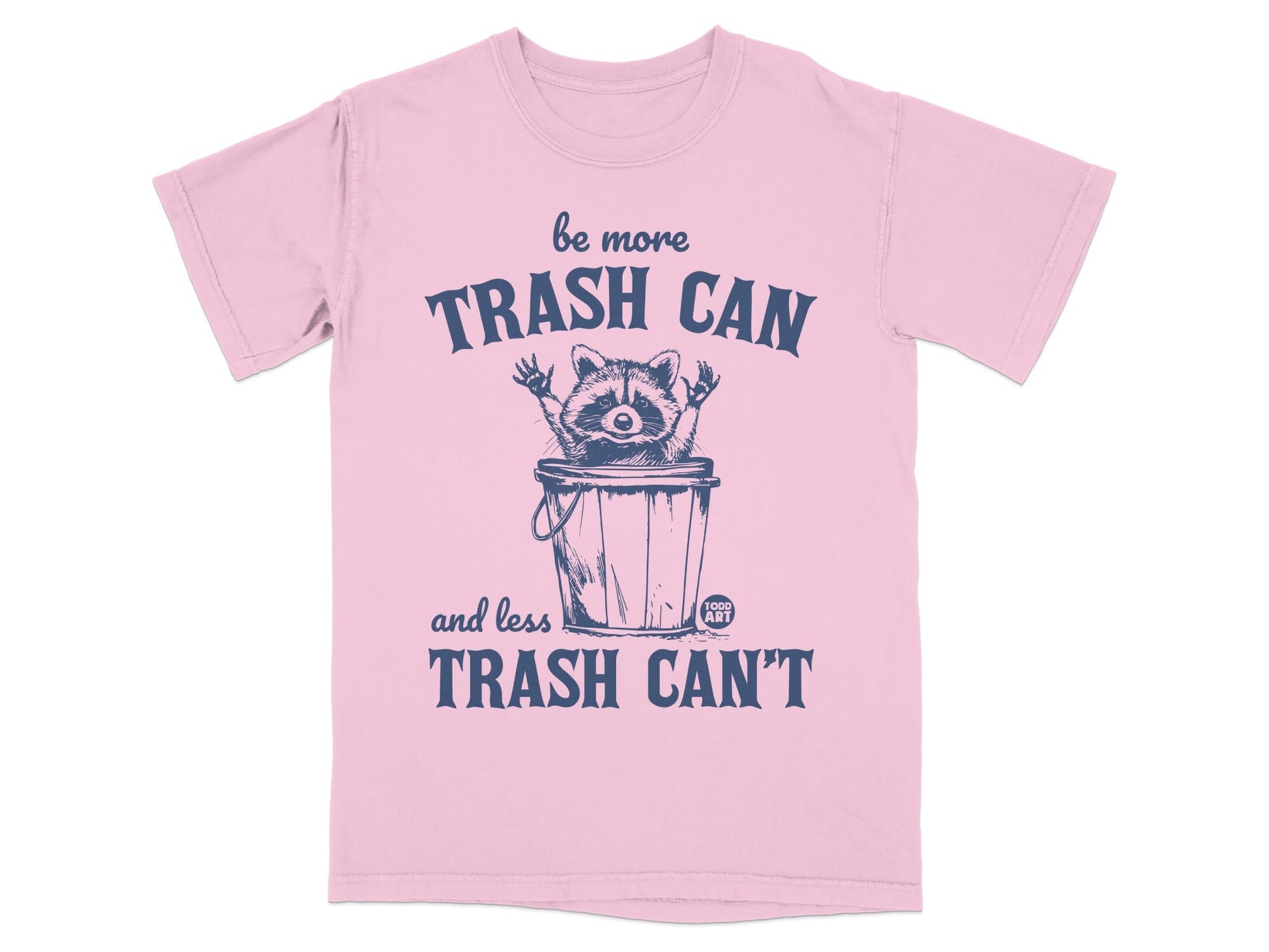 Pink t-shirt with raccoon in trash can saying "be more TRASH CAN and less TRASH CAN'T".