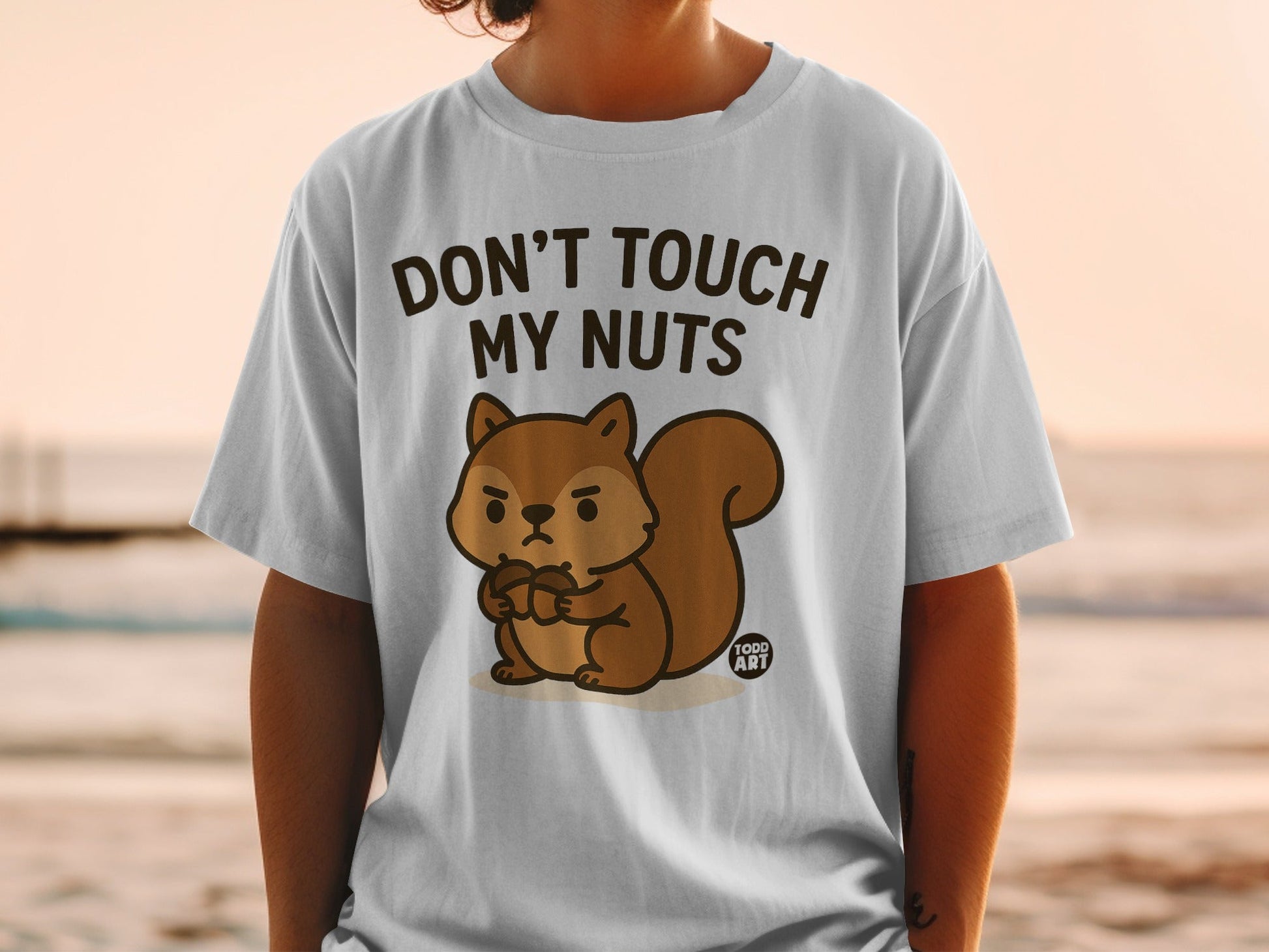 T-shirt with cartoon squirrel and text "DON'T TOUCH MY NUTS".