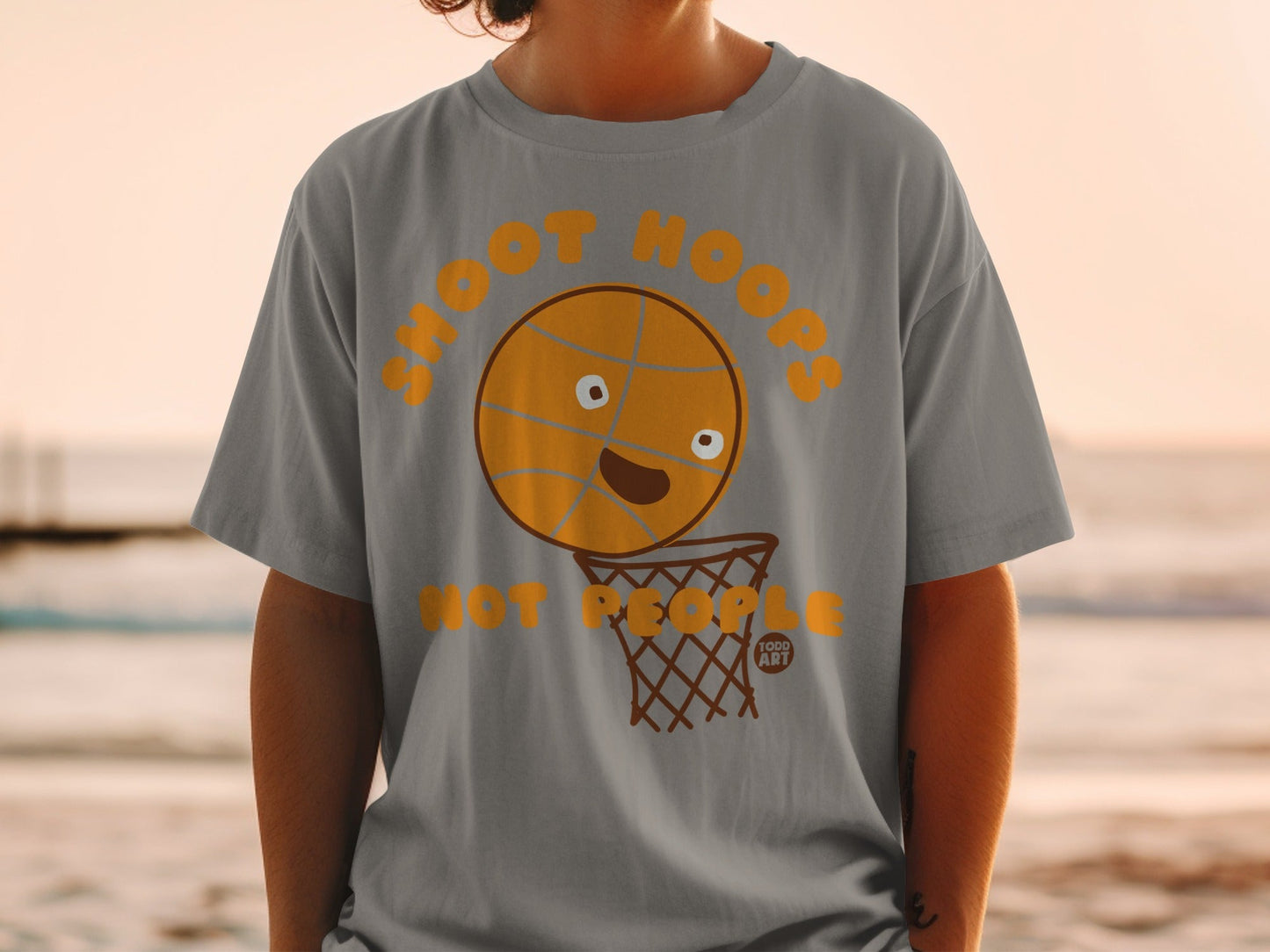 Grey t-shirt with cartoon basketball in hoop and text "SHOOT HOOPS".