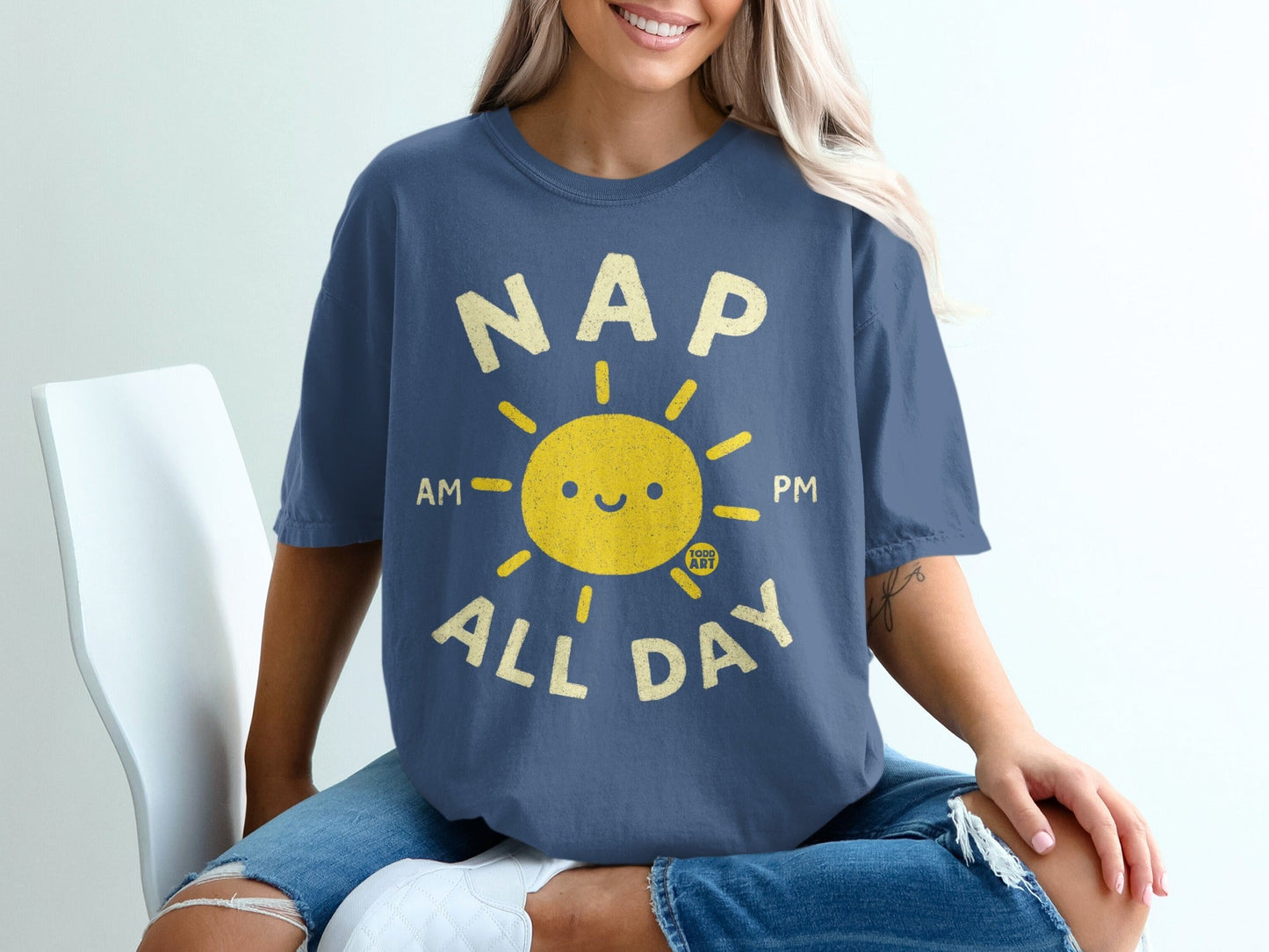 Navy blue t-shirt with yellow sun graphic and "NAP ALL DAY" text.