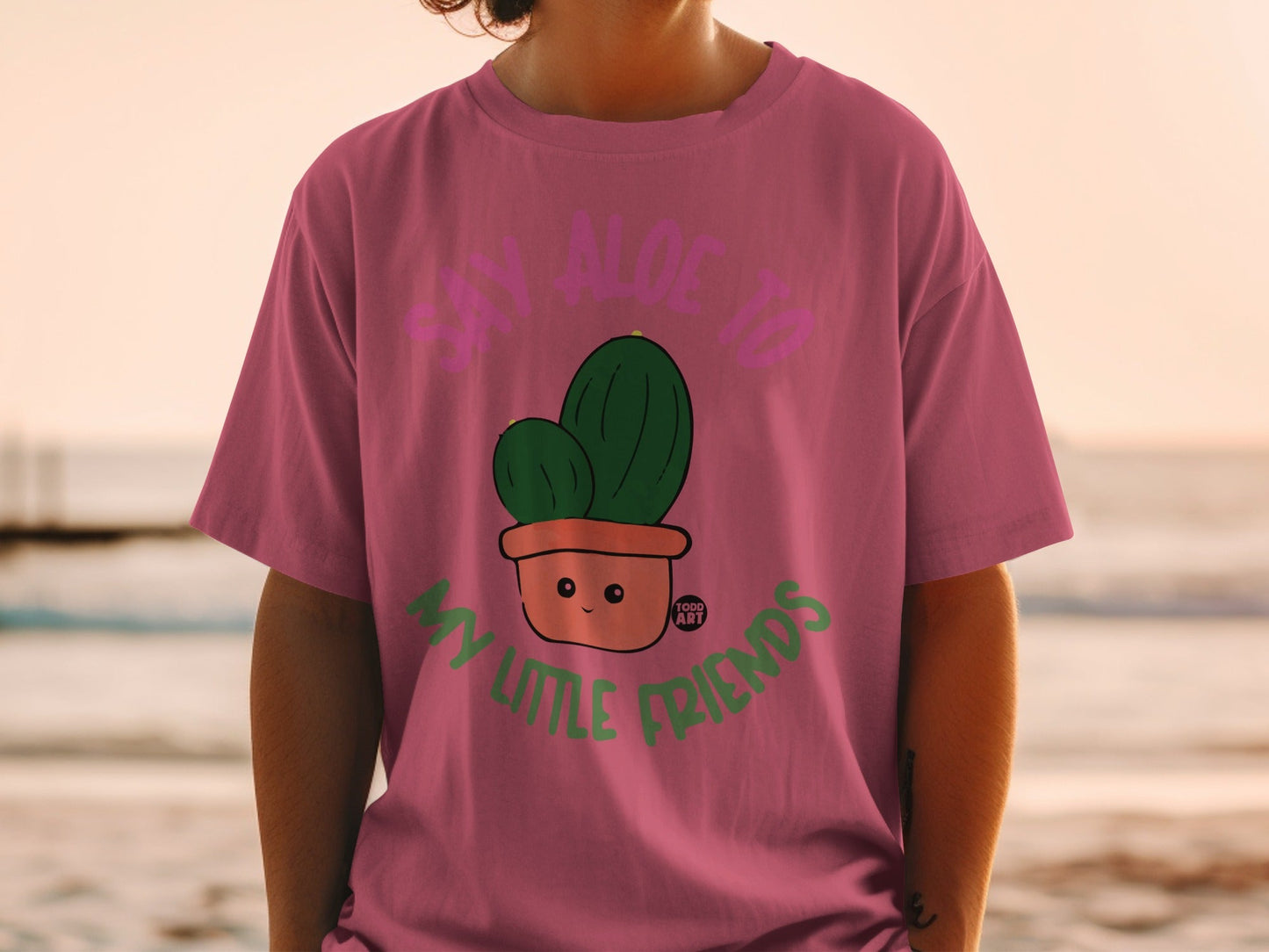 T-shirt with cartoon cactus in pot and text "Say Aloe to My Little Friends".
