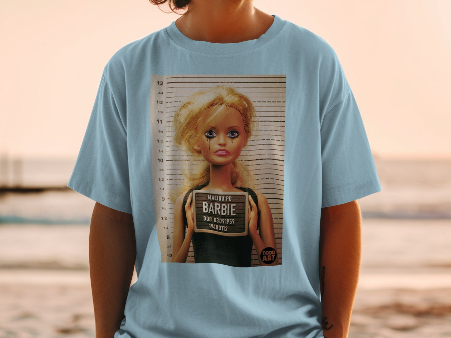 Barbie mugshot with "Malibu PD" and DOB 03091959.