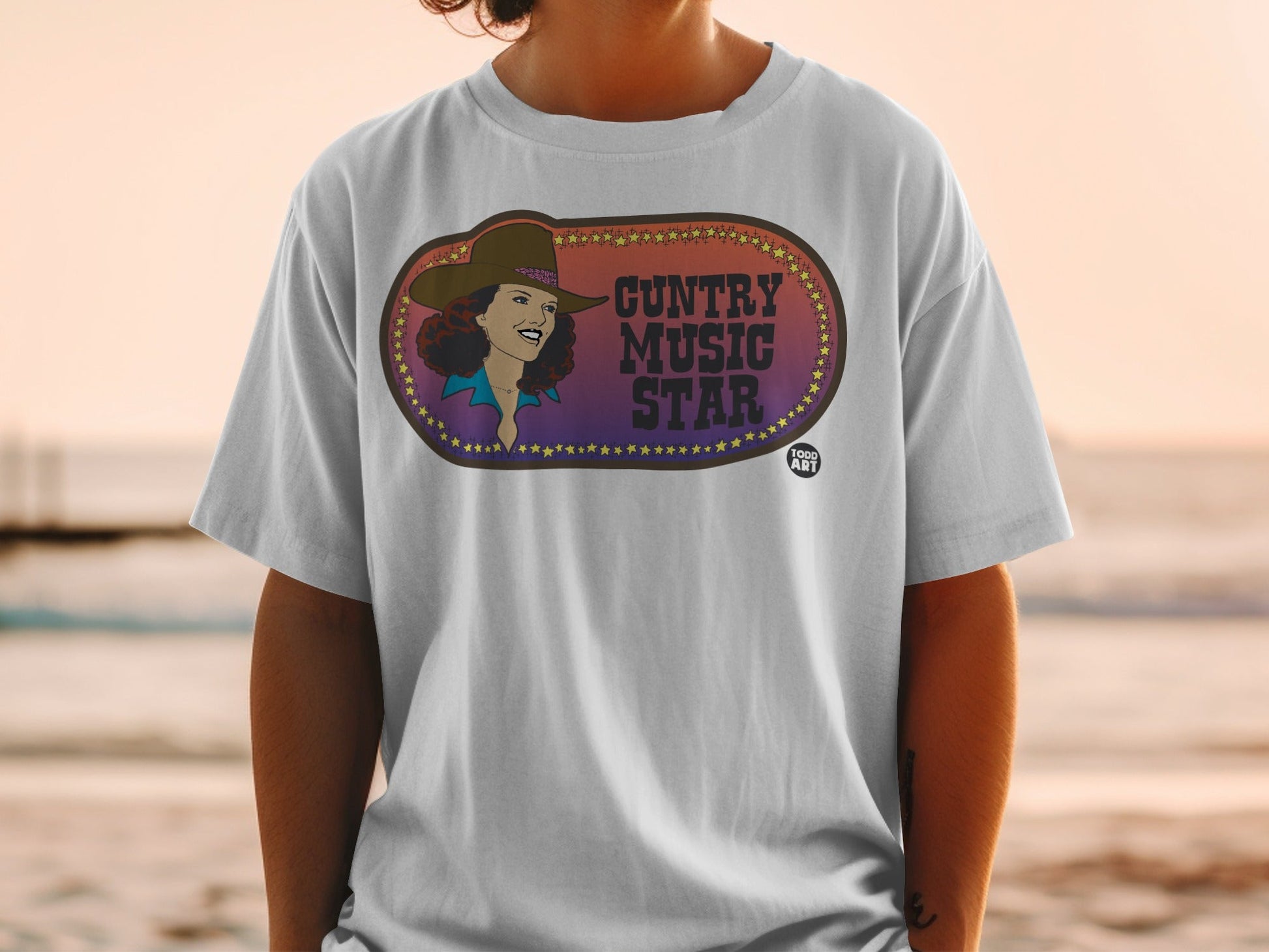 Country music star graphic on a white t-shirt, oval design.