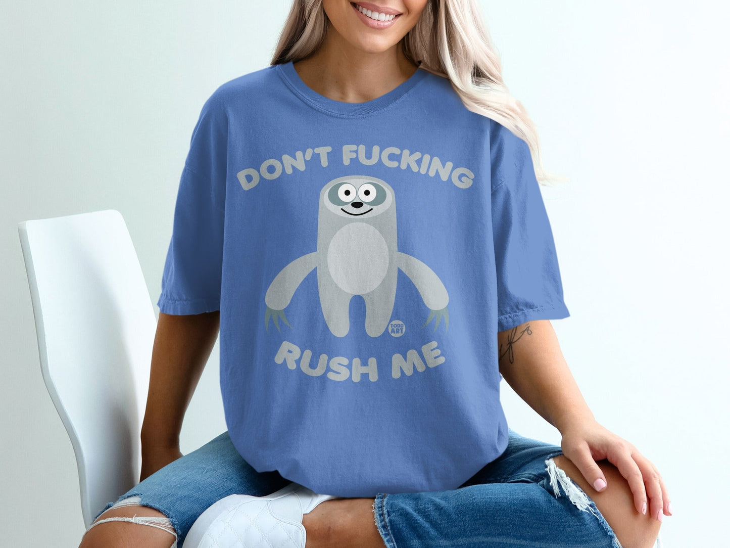 Blue t-shirt with sloth graphic and text "DON'T FUCKING RUSH ME".