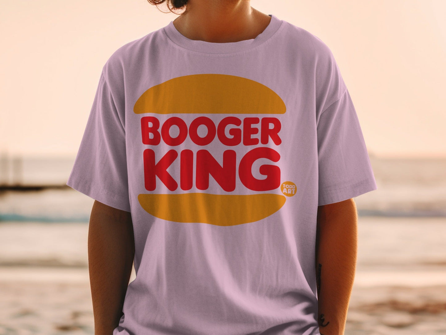 Purple t-shirt with red "Booger King" text in a yellow bun shape.
