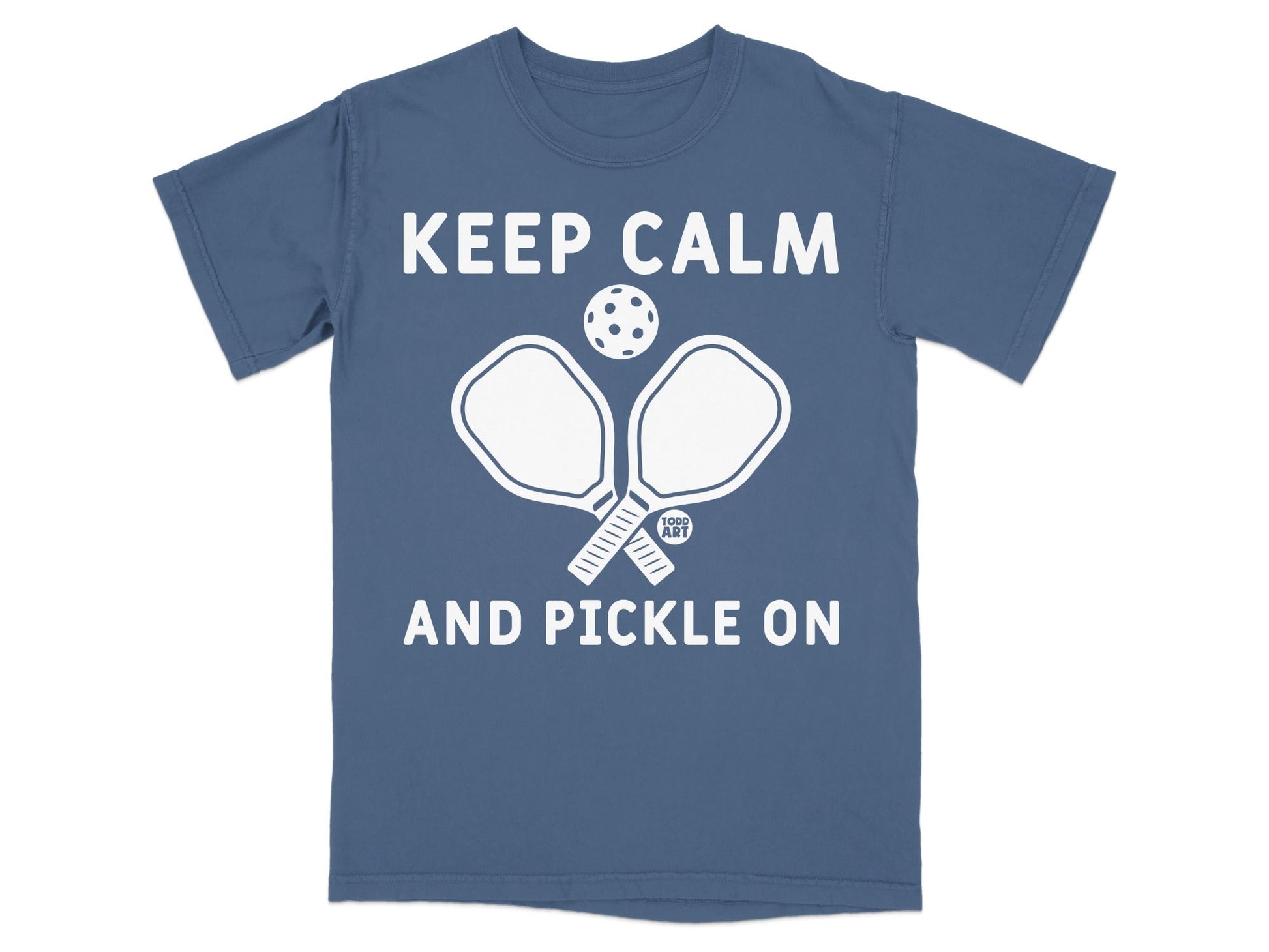 Blue t-shirt with "Keep Calm and Pickle On" and pickleball paddles.