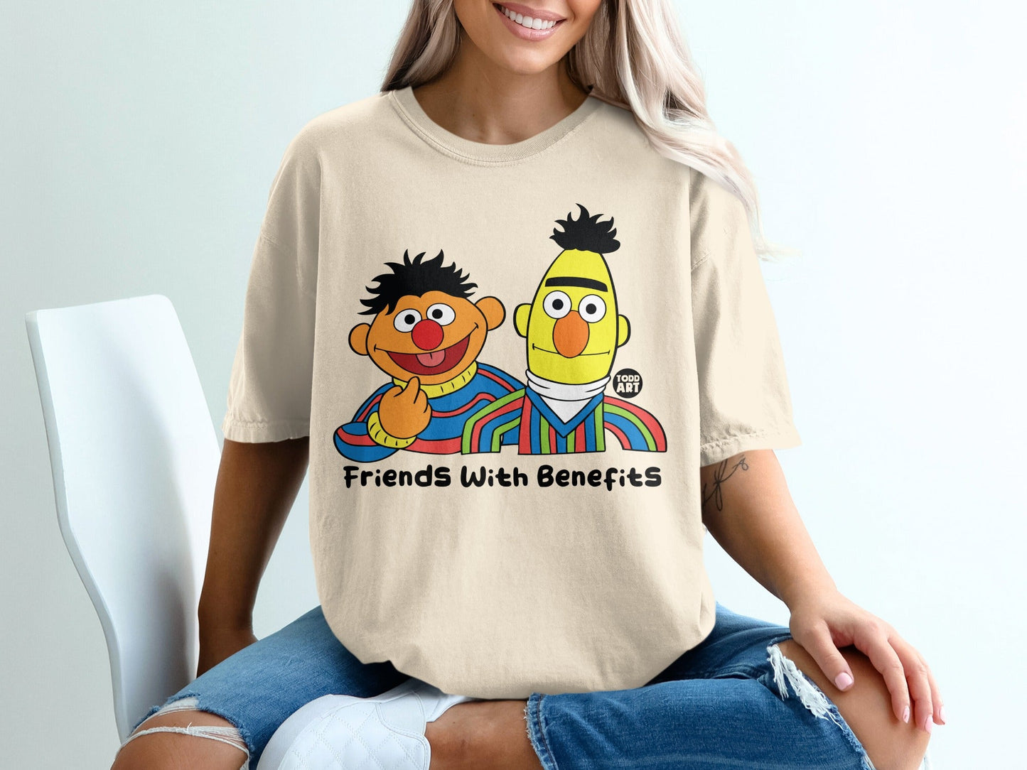 Ernie and Bert characters on a cream t-shirt with "Friends With Benefits" text.