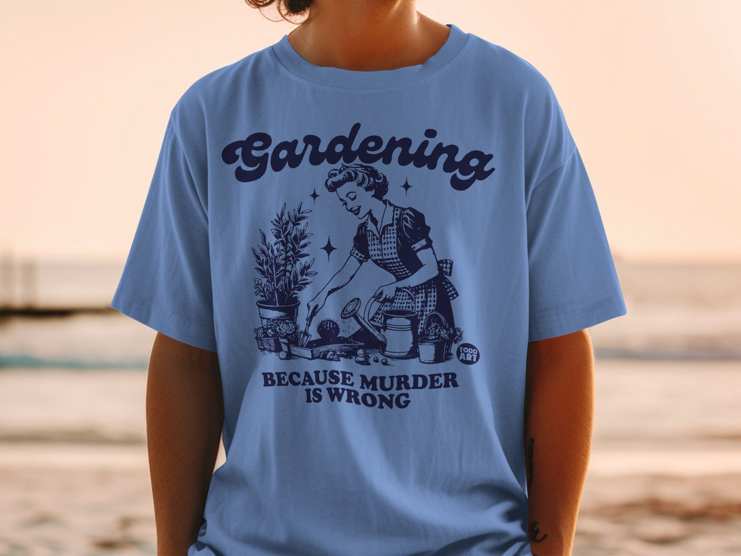 T-shirt with vintage gardening illustration and text "Gardening is Murder Wrong".