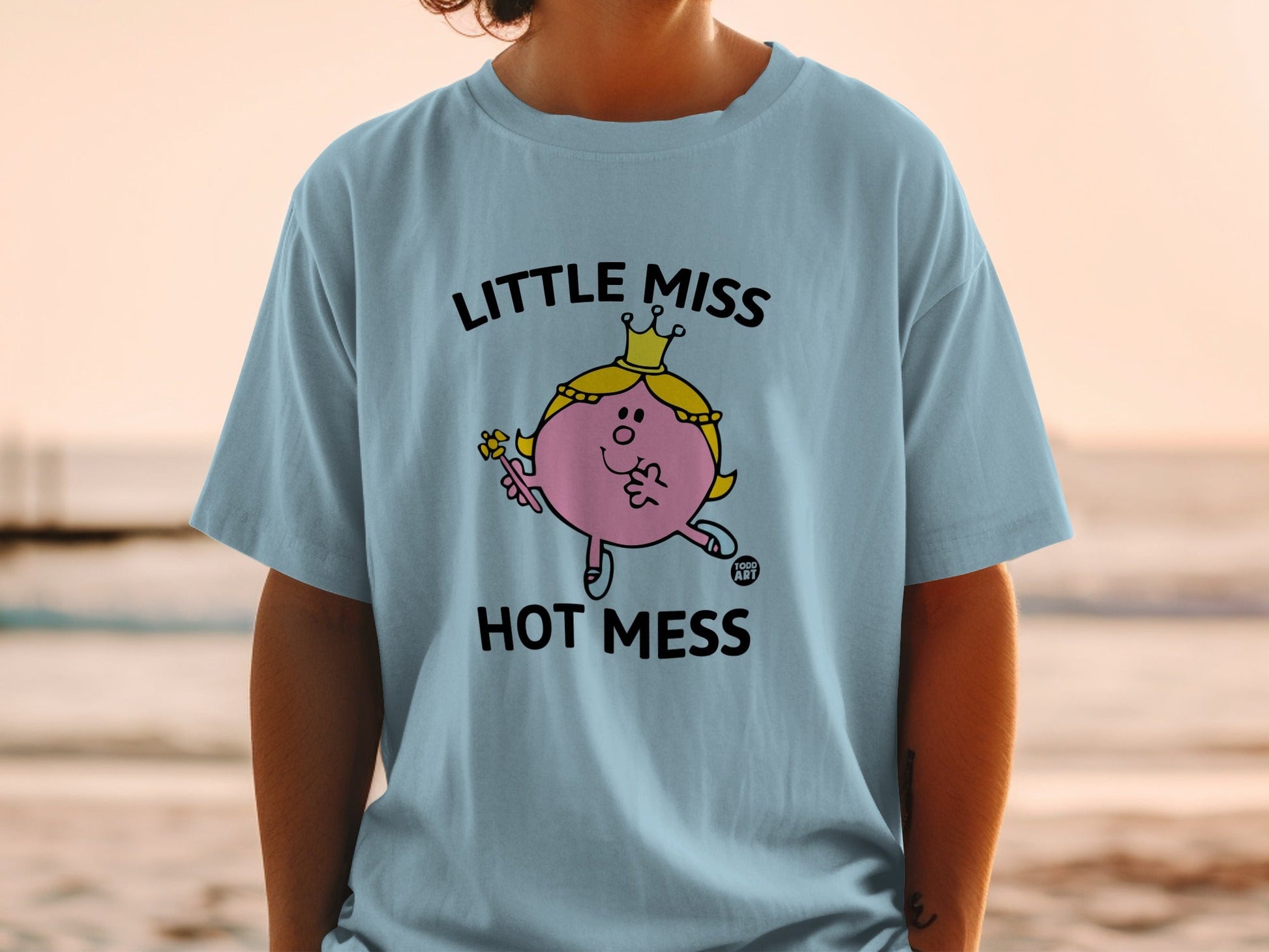 Light blue t-shirt with "Little Miss Hot Mess" and character illustration.