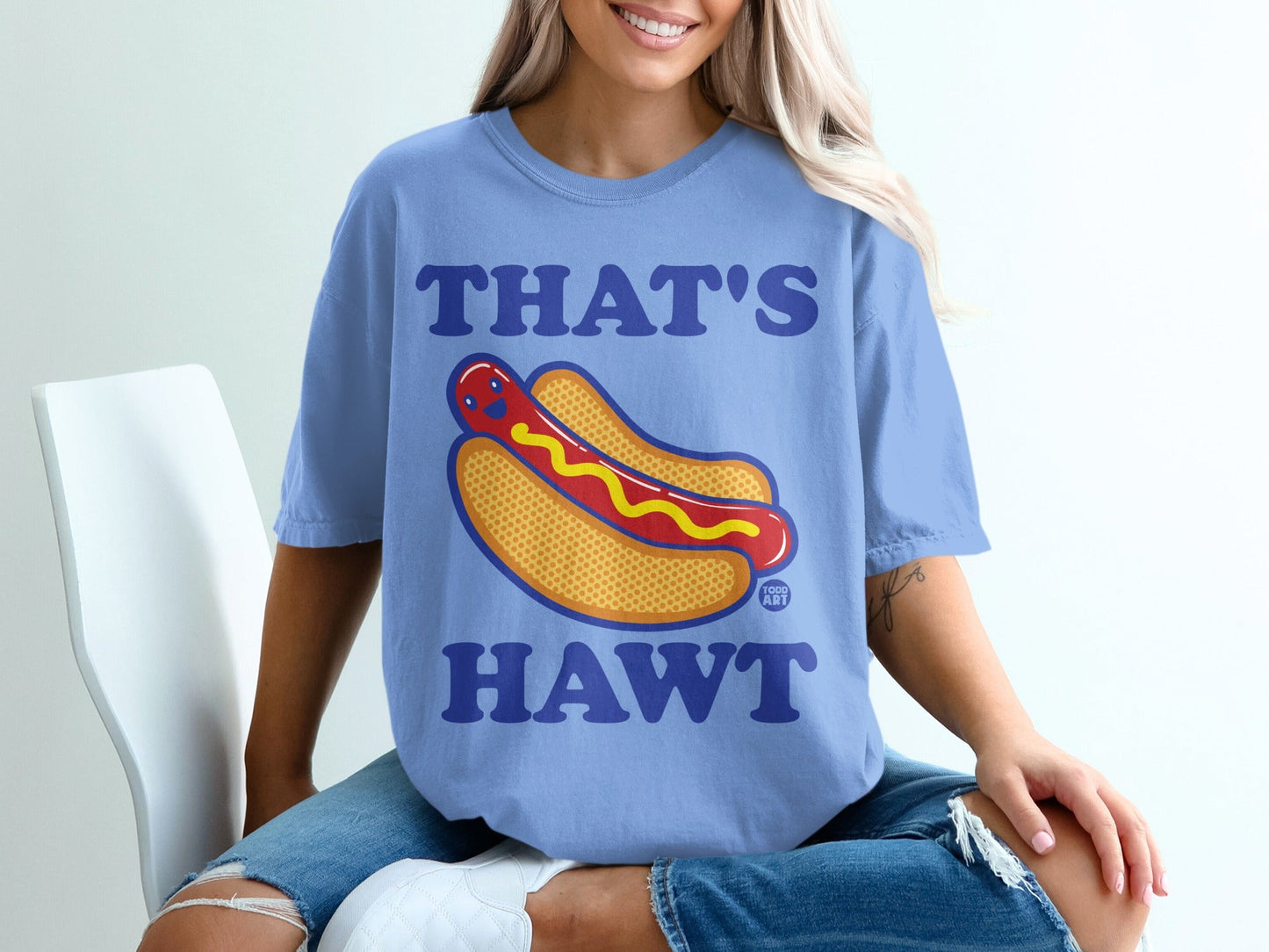 Blue t-shirt with cartoon hot dog and text "THAT'S HAWT".