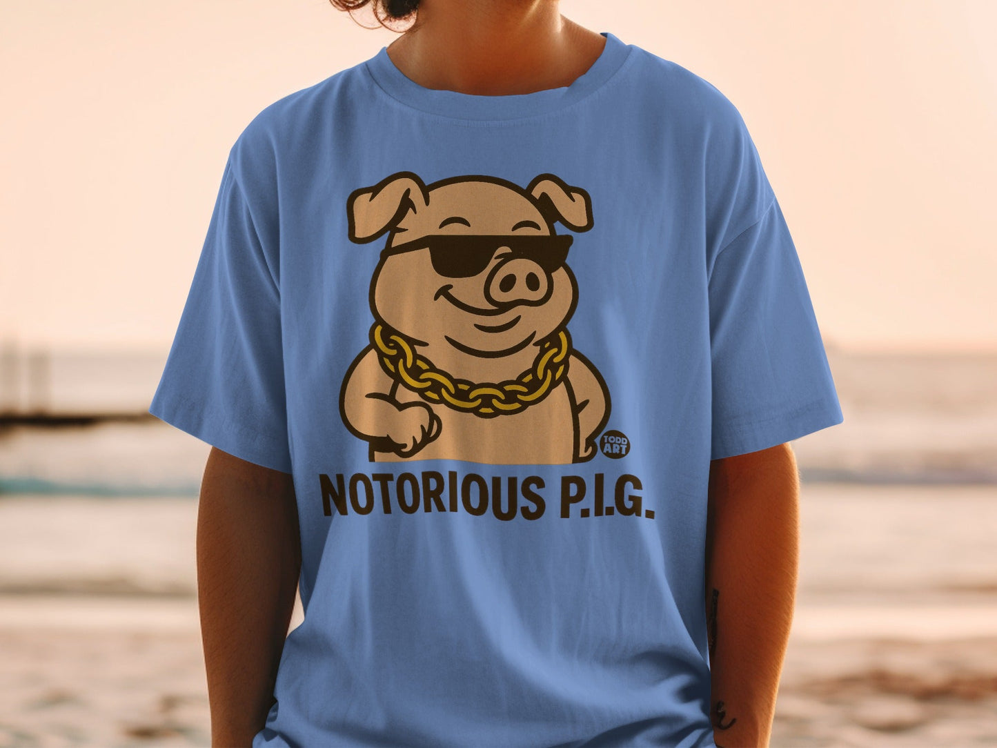 Cartoon pig wearing sunglasses and gold chain, "Notorious P.I.G." text.