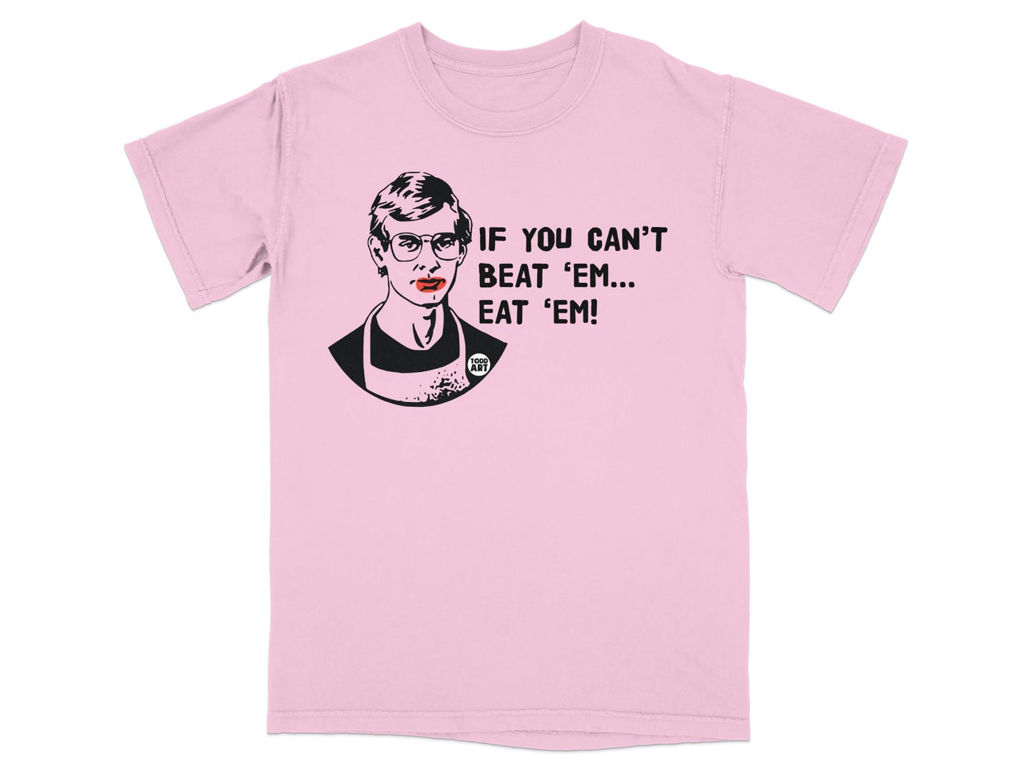 Pink t-shirt with graphic of Jeffrey Dahmer and text "IF YOU CAN'T BEAT 'EM... EAT 'EM!".