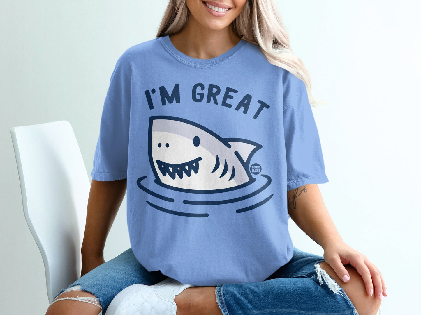 Blue t-shirt with a cartoon shark that says "I'M GREAT".