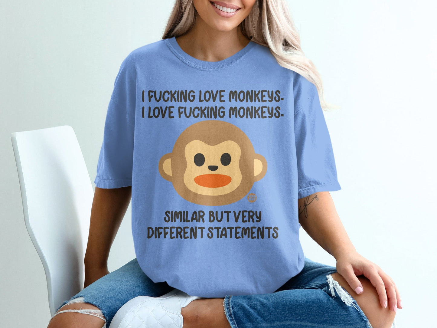 Light blue t-shirt with brown monkey graphic and text: "I FUCKING LOVE MONKEYS. SIMILAR BUT VERY DIFFERENT STATEMENTS."