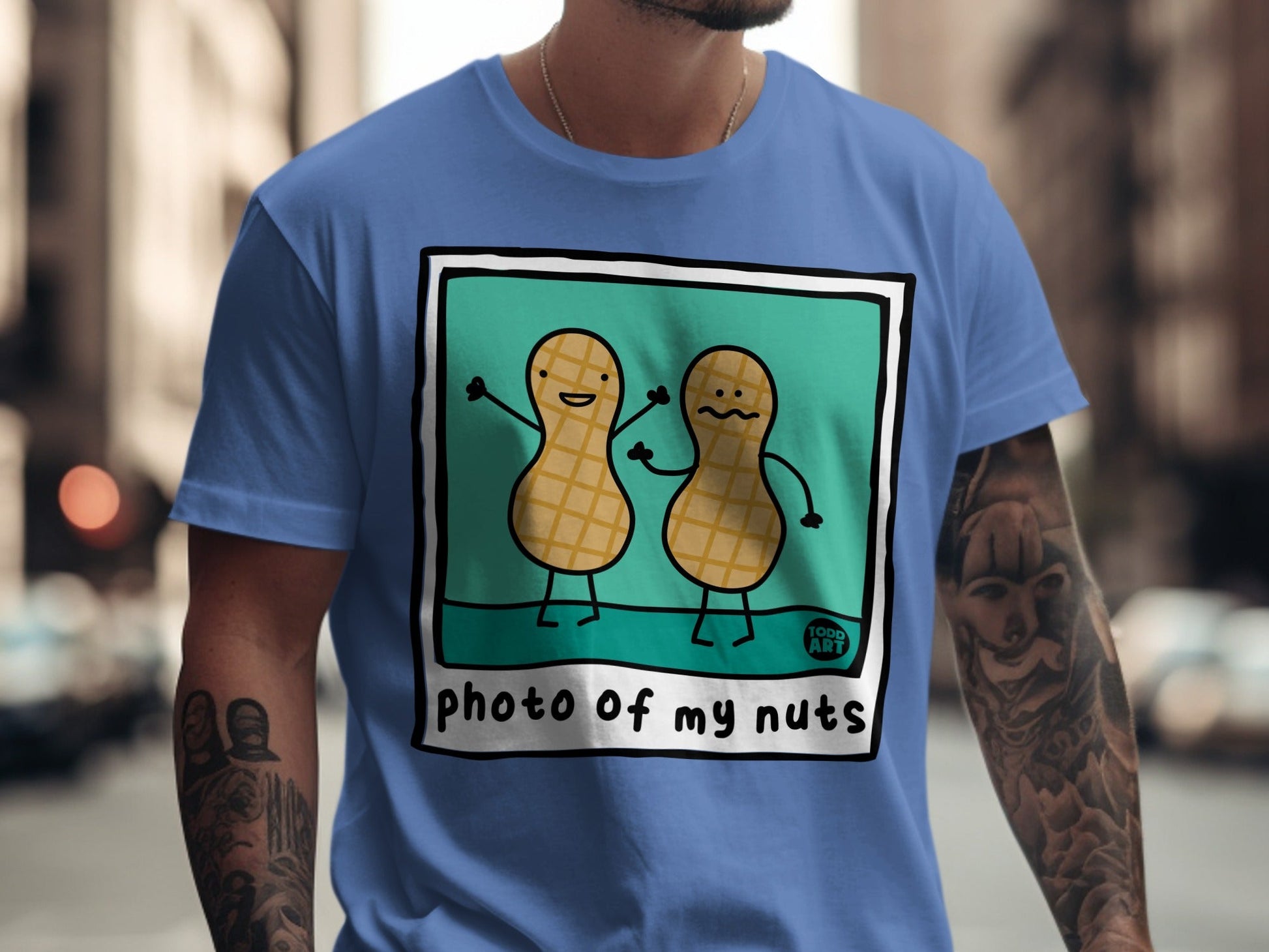Blue t-shirt with cartoon peanuts holding hands, "photo of my nuts" text.