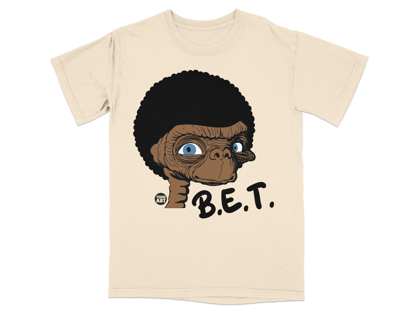 E.T. cartoon character with afro and "B.E.T." text on a cream t-shirt.