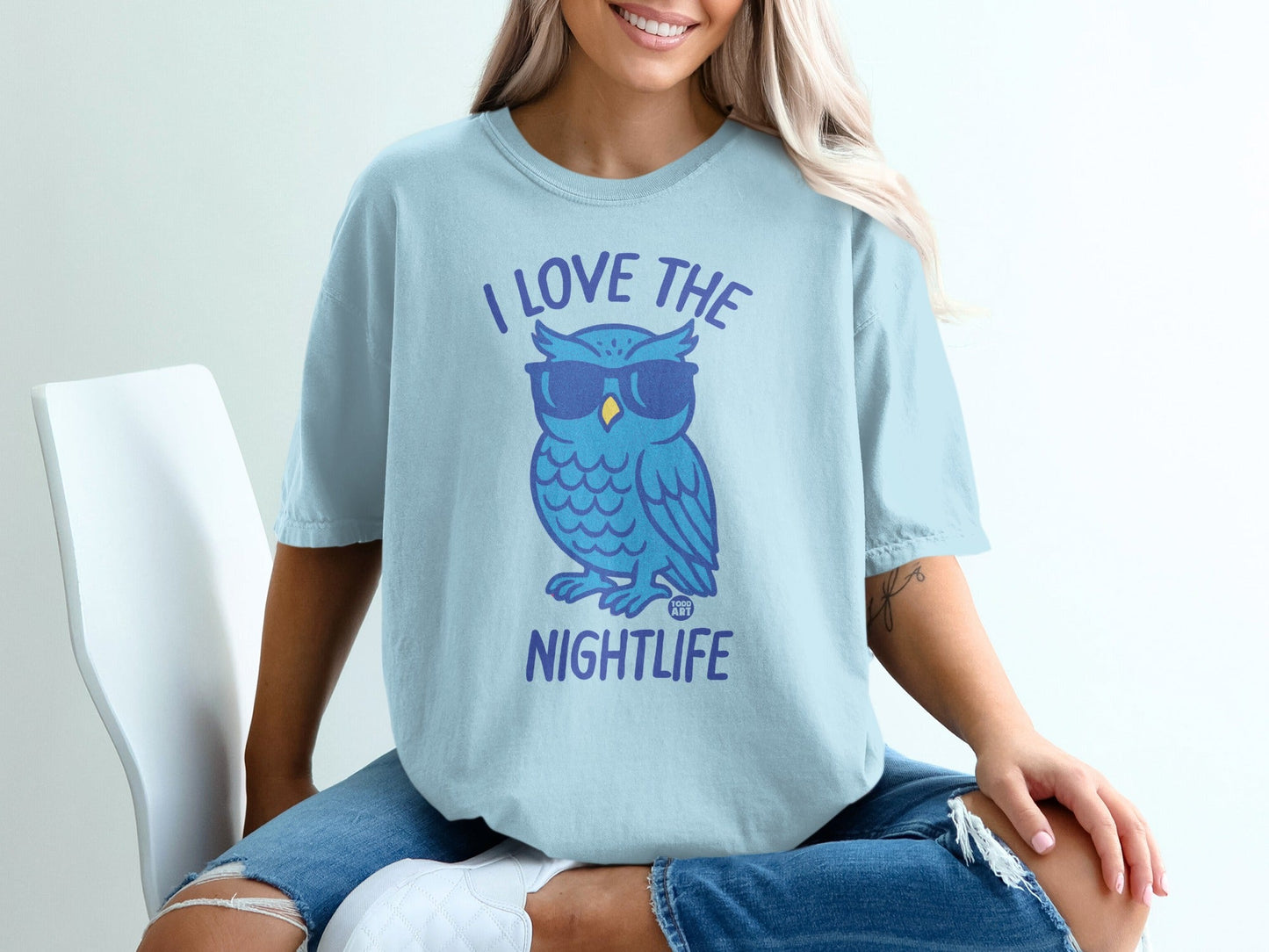 Light blue t-shirt with blue cartoon owl wearing sunglasses and text "I LOVE THE NIGHTLIFE".