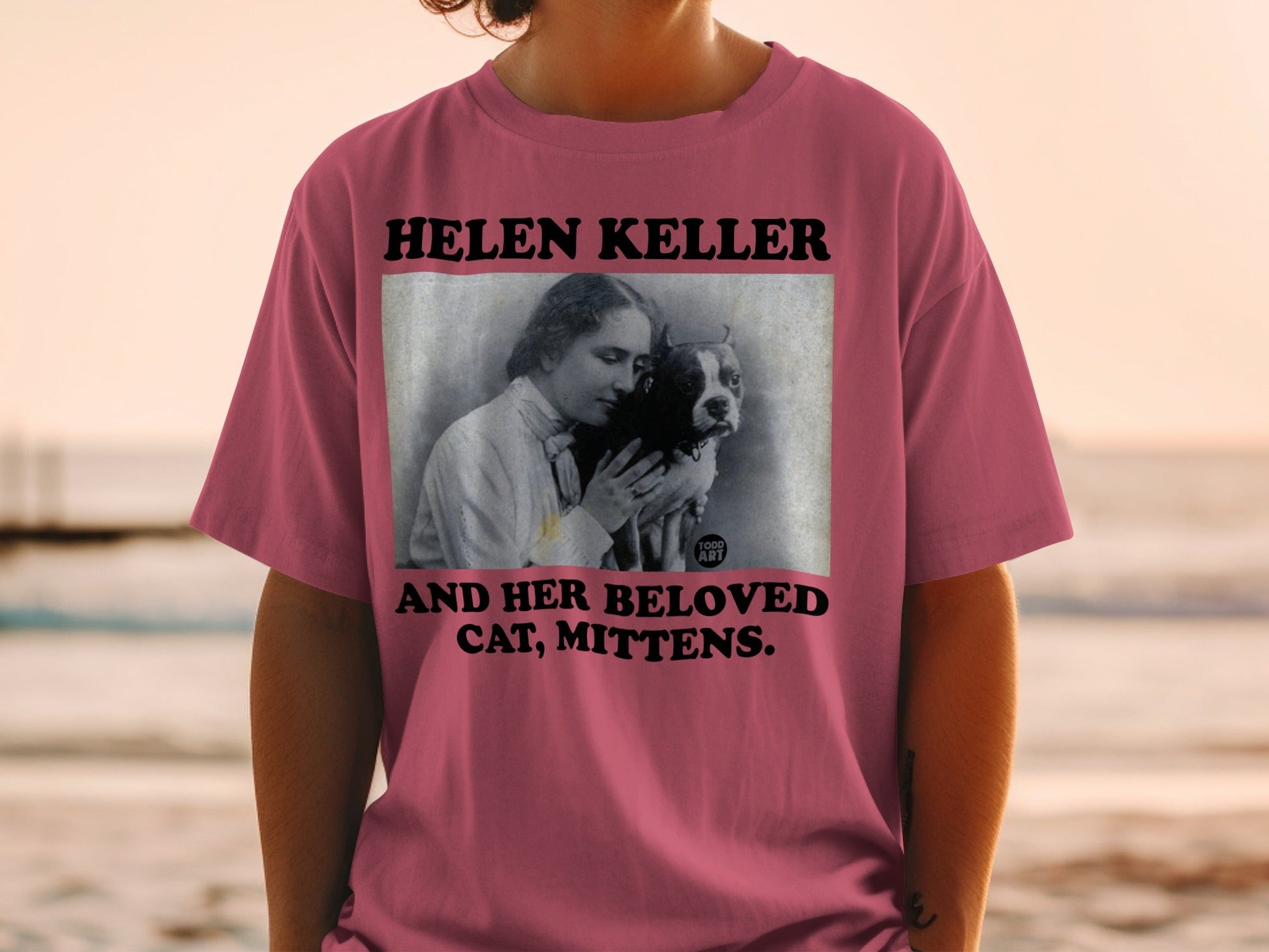 T-shirt featuring Helen Keller holding a dog named Mittens.