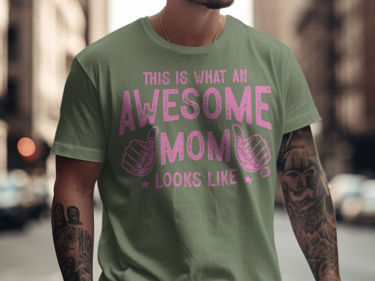 Green t-shirt with pink text that reads "This is what an awesome mom looks like".