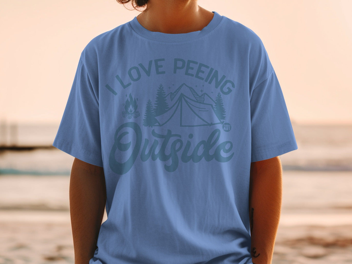 Blue t-shirt with "I Love Peeing Outside" and camping graphic.