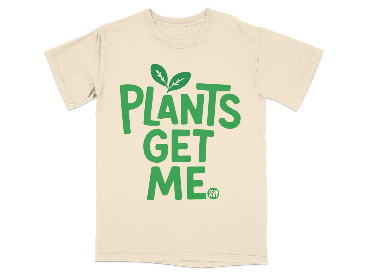 Cream t-shirt with green text "PLANTS GET ME" and a small "TODD ART" logo.