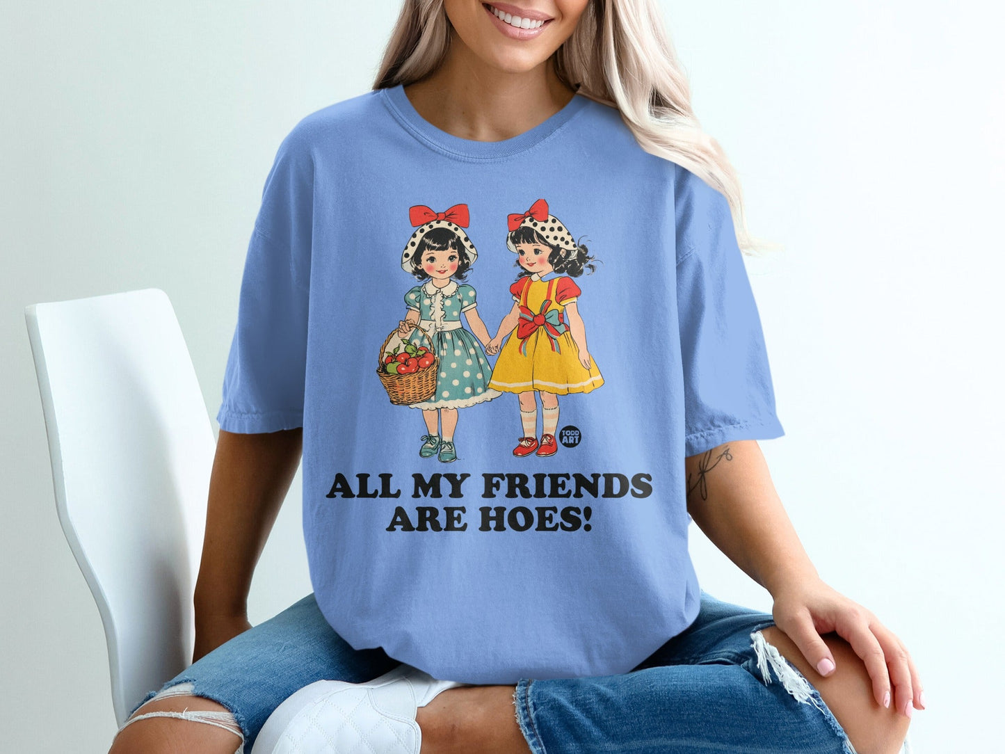 Blue t-shirt with two cartoon girls and text "ALL MY FRIENDS ARE HOES!".